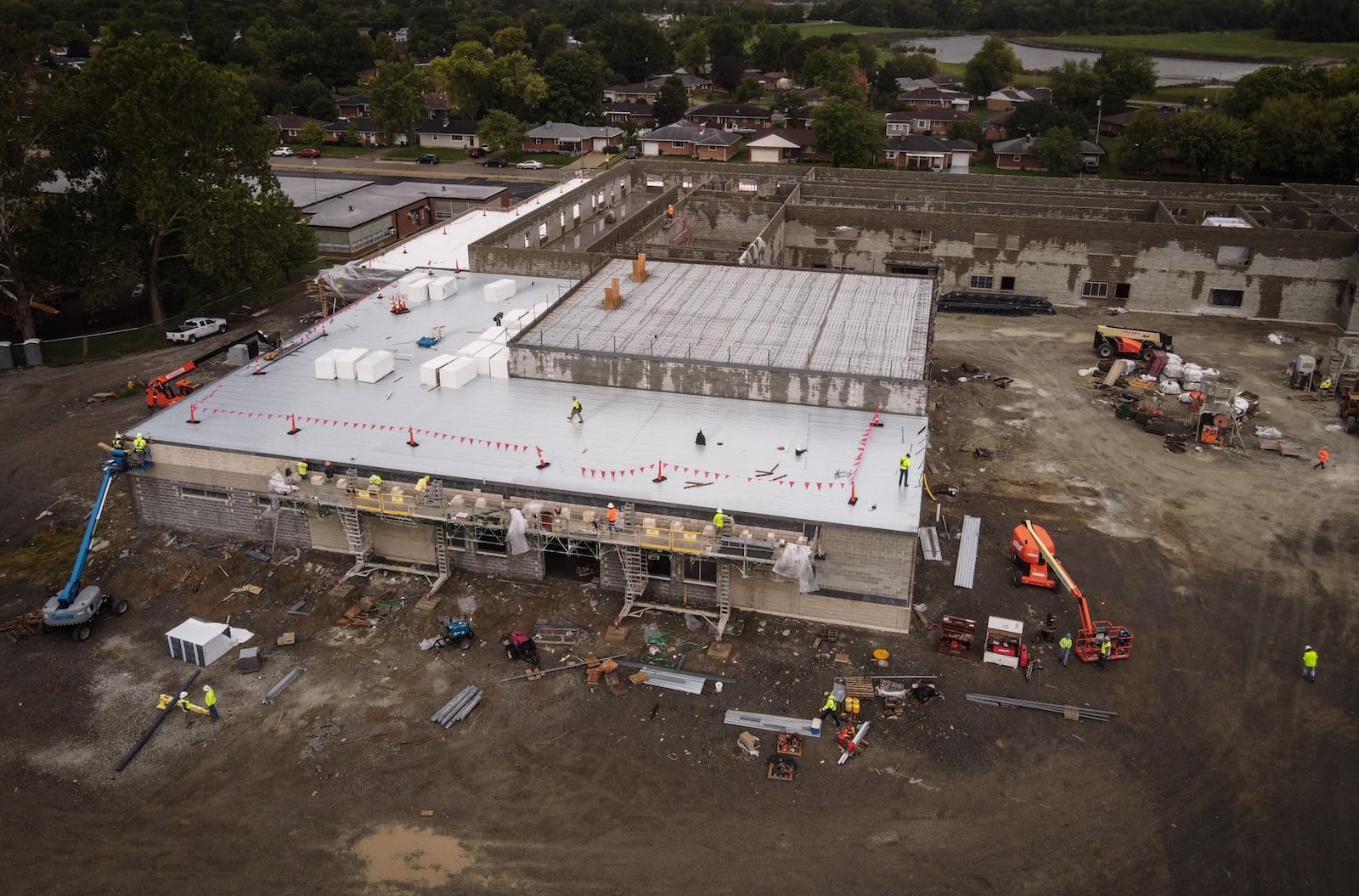 Crews work on the new West Carrollton Early Childhood Center on 510 E. Pease Ave. JIM NOELKER/STAFF