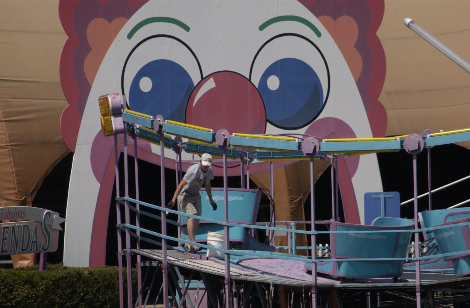 An employee inspects a ride in 2002 at the former Americana Amusement Park in Monroe. The park, built in 1922, went through several ownership changes before finally closing in 2002 when it was known as LeSourdsville Lake Amusement Park.