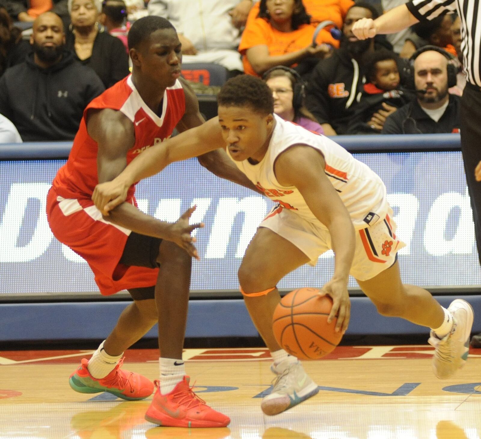 Doug Spear of Stivers (with ball) avoids a defender. Stivers defeated Cin. Deer Park 76-62 in a boys high school basketball D-III district final at UD Arena on Sunday, March 10, 2019. MARC PENDLETON / STAFF