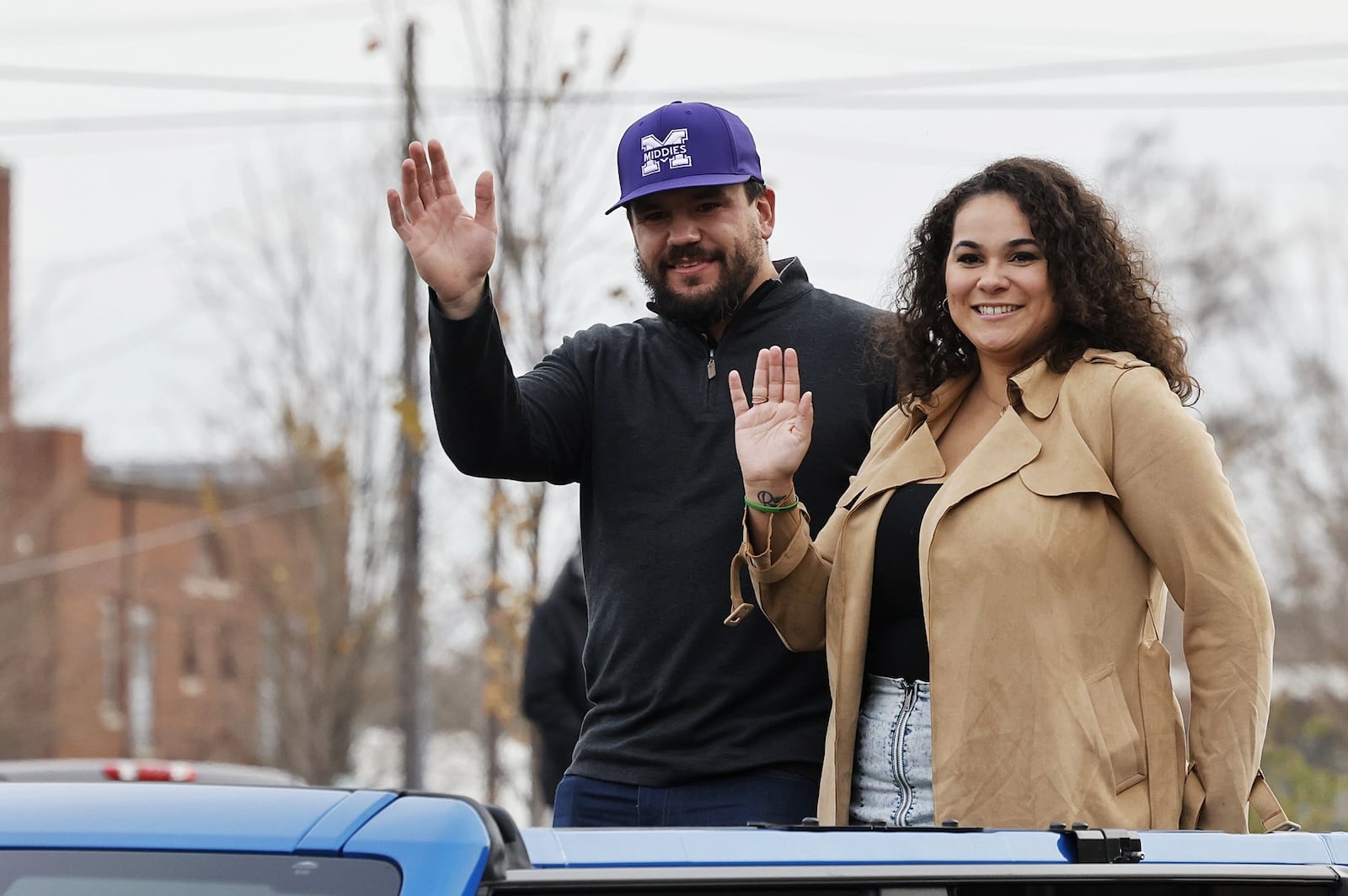 Kyle Schwarber and wife, Paige, wave at the crowd during the Middletown Santa Parade Saturday, Nov. 26, 2022 in downtown Middletown. Middletown native Kyle Schwarber served as grand marshal. NICK GRAHAM/STAFF