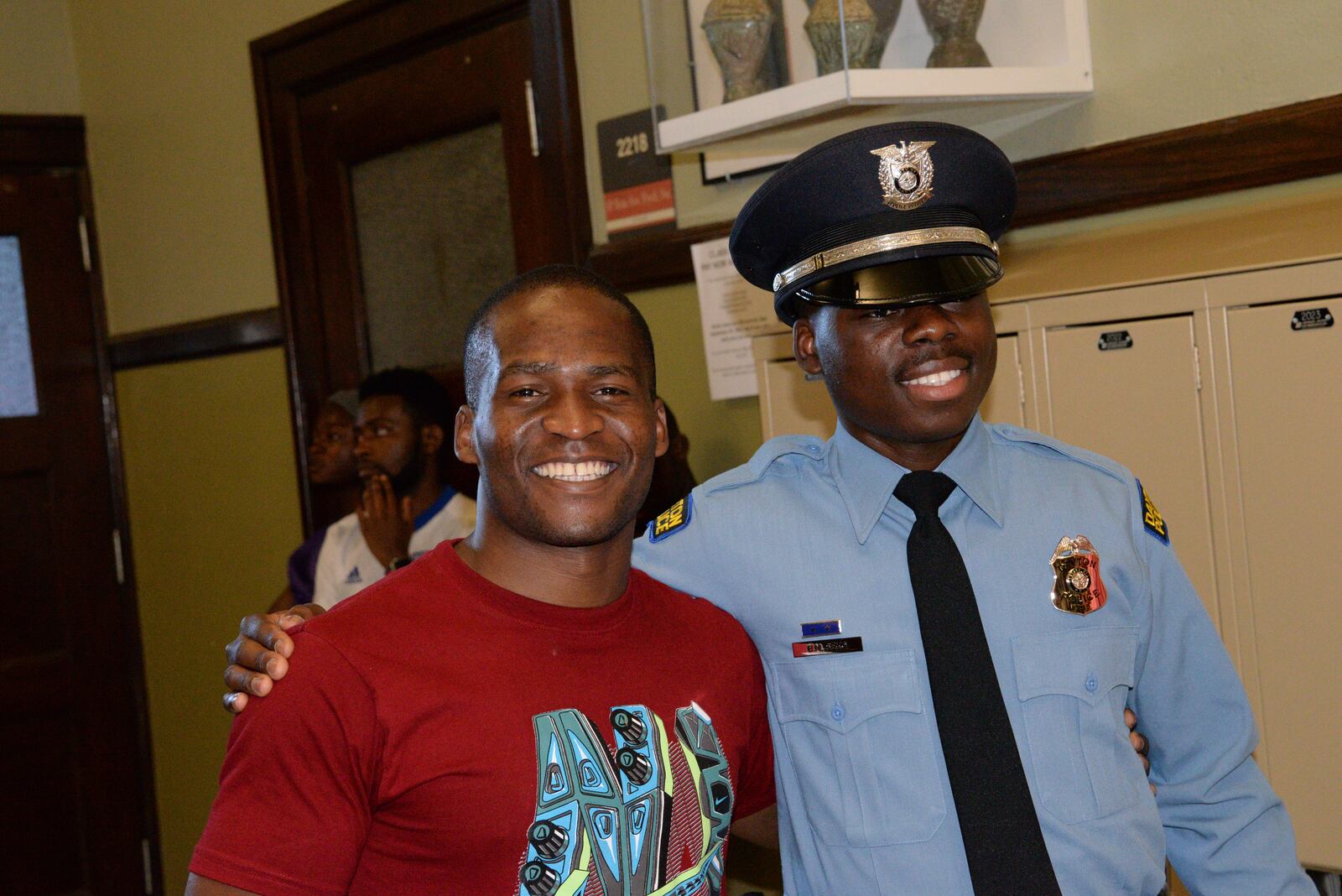 Dayton Police officers Ndayisaba Ramadhan (left)  and Bibebibyo “Bibe” Seko (right) at Bibe’s graduation (Photo by Gary Laughlin)