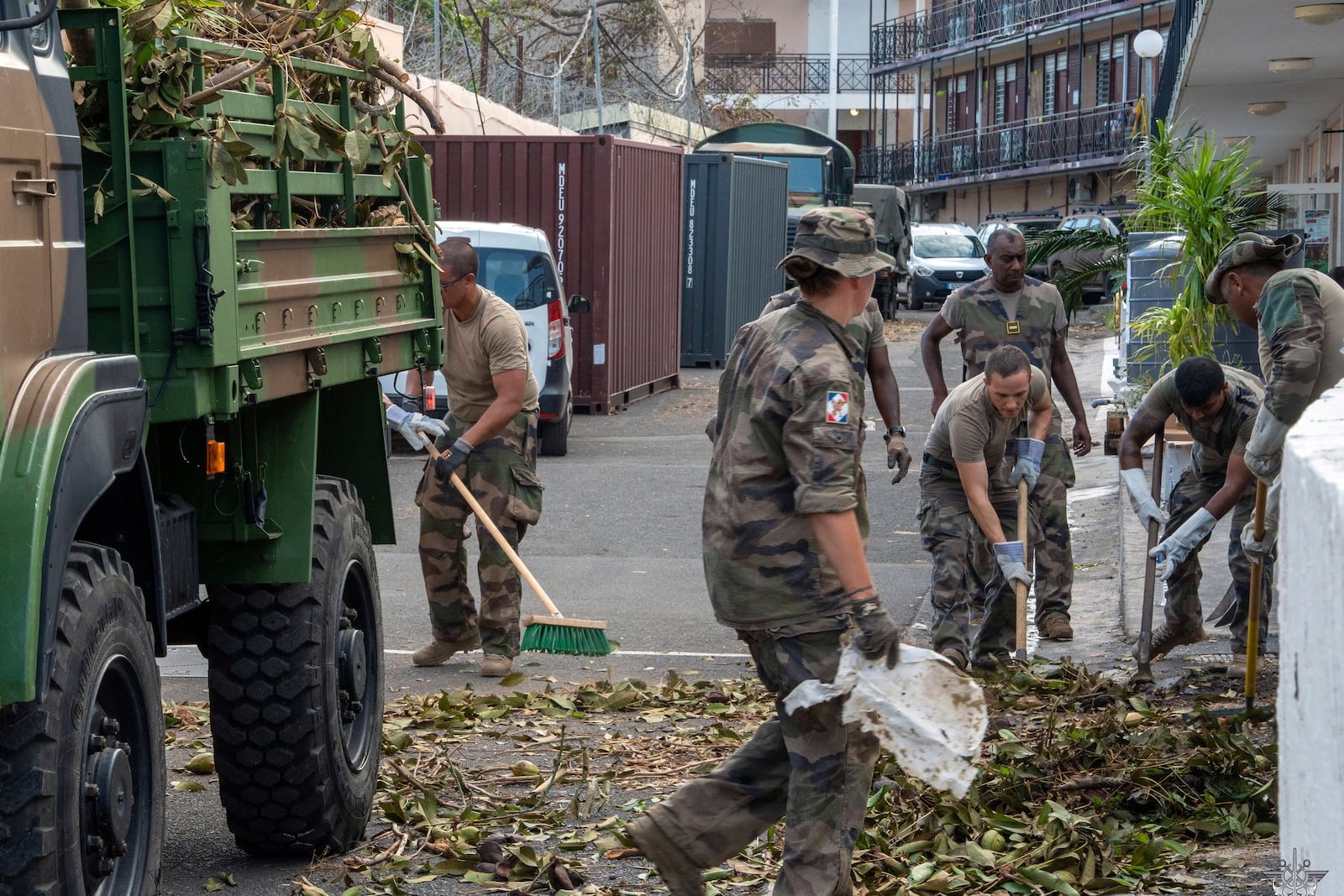 This photo provided by the French Army shows soldiers clearing a road in the Indian Ocean French territory of Mayotte, Wednesday Dec.18, 2024, as the cyclone on Saturday was the deadliest storm to strike the territory in nearly a century. (D Piatacrrea, Etat Major des Armees/Legion Etrangere via AP)