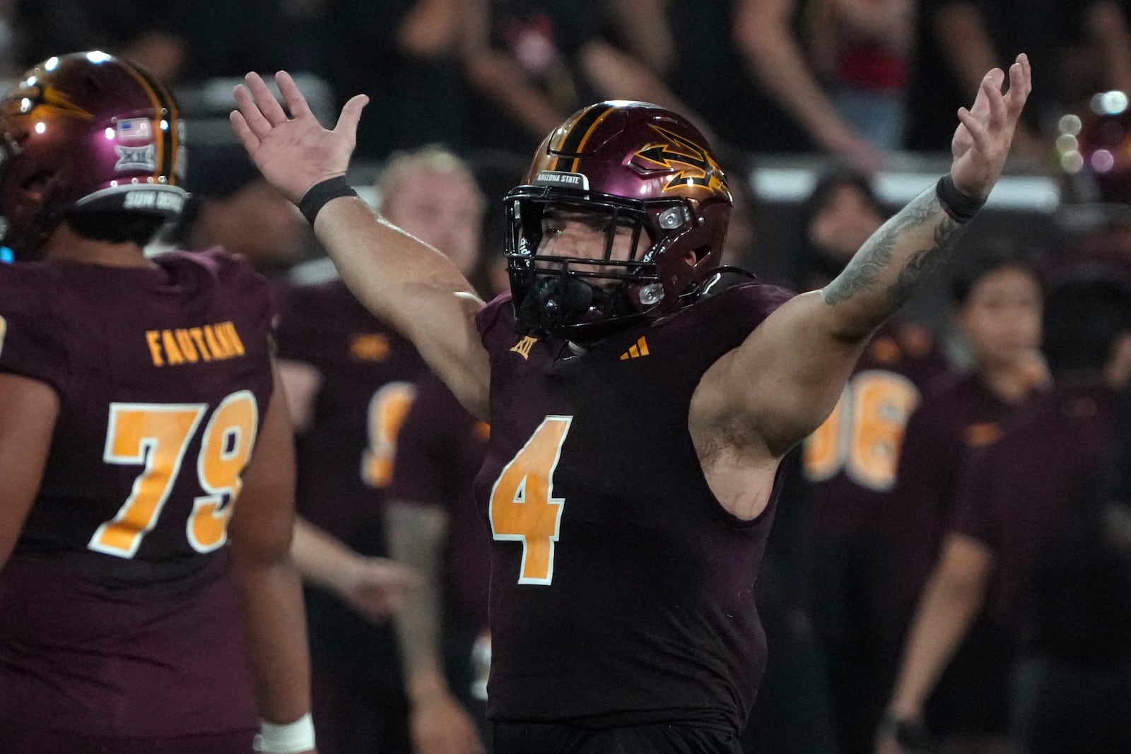 Arizona State running back Cam Skattebo (4) reacts after defeating Utah during an NCAA college football game, Friday, Oct. 11, 2024, in Tempe, Ariz. (AP Photo/Rick Scuteri)