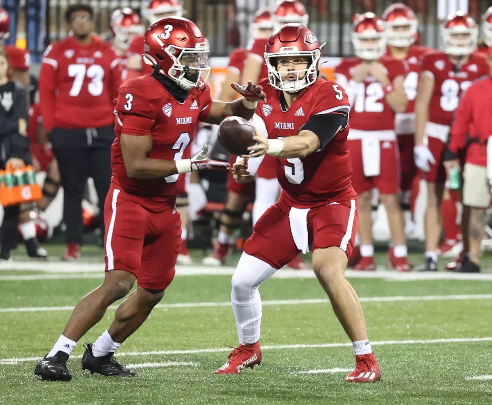 Miami quarterback Brett Gabbert (5) looks to hand the ball off to running back Keyon Mozee (3) against Northern Illinois last week at Yager Stadium. Miami Athletics photo