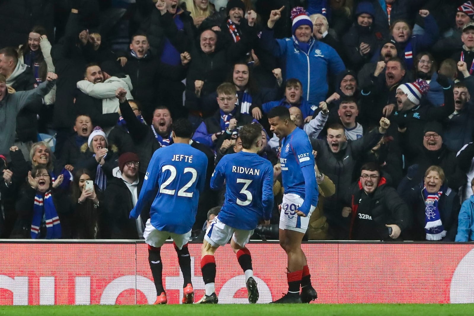 Rangers' Hamza Igamane, right, celebrates after scoring the opening goal during the Europa League opening phase soccer match between Glasgow Rangers and Tottenham Hotspur at Ibrox stadium in Glasgow, Thursday, Dec. 12, 2024. (AP Photo/Scott Heppell)