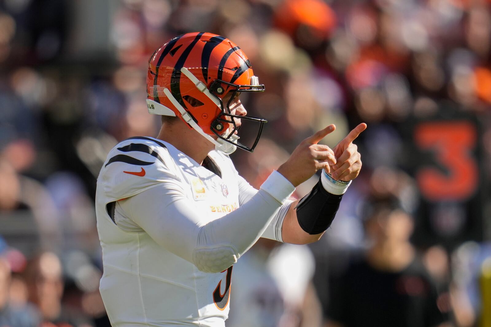 Cincinnati Bengals quarterback Joe Burrow (9) calls out in the second half of an NFL football game against the Cleveland Browns, Sunday, Oct. 20, 2024, in Cleveland. (AP Photo/Sue Ogrocki)