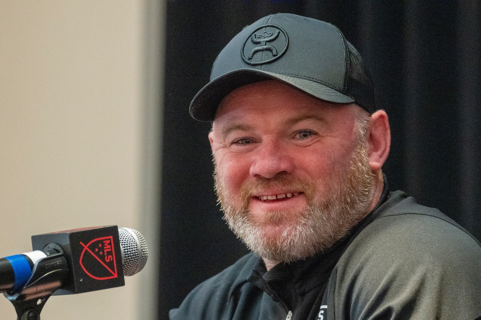 FILE - MLS All-Star head coach Wayne Rooney, of DC United, smiles as he speaks with reporters during MLS All-Star events, Tuesday, July 18, 2023, in Washington. (AP Photo/Alex Brandon, File)