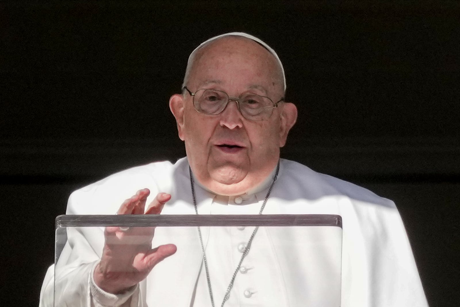 Pope Francis delivers his blessing as he recites the Angelus noon prayer from the window of his studio overlooking St.Peter's Square, at the Vatican, Thursday, Dec. 26, 2024. (AP Photo/Andrew Medichini)