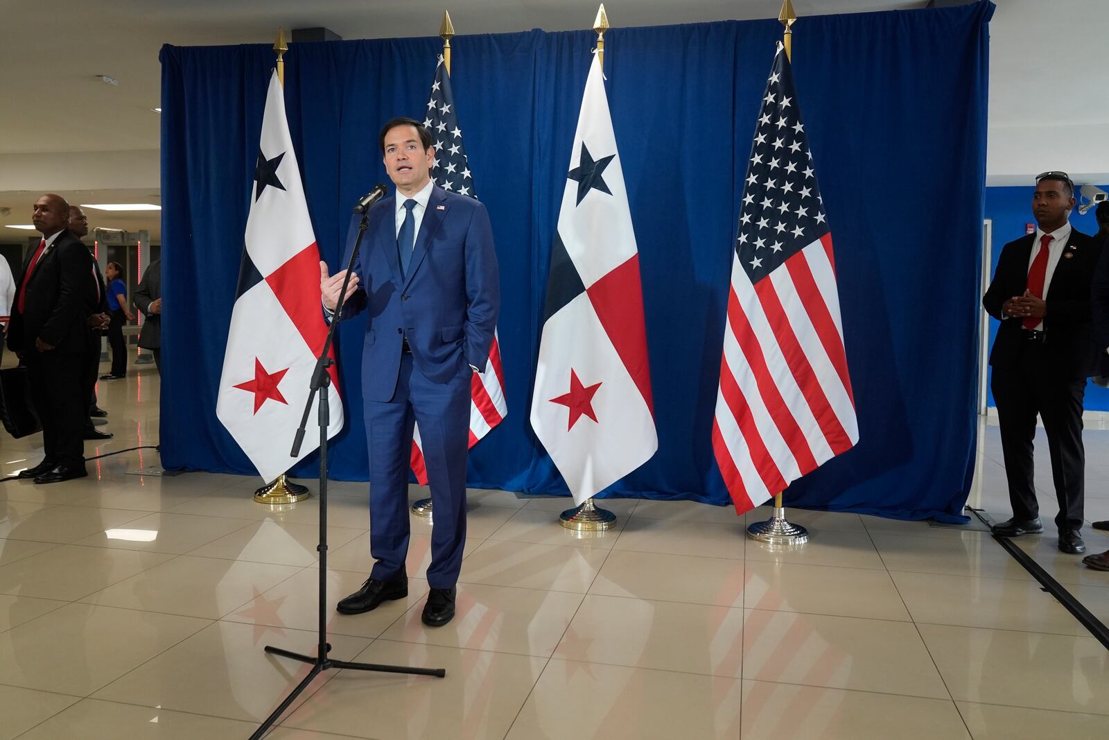 Secretary of State Marco Rubio speaks to reporters after watching people board a repatriation flight bound for Colombia at Albrook Airport in Panama City, Monday, Feb. 3, 2025. (AP Photo/Mark Schiefelbein, Pool)