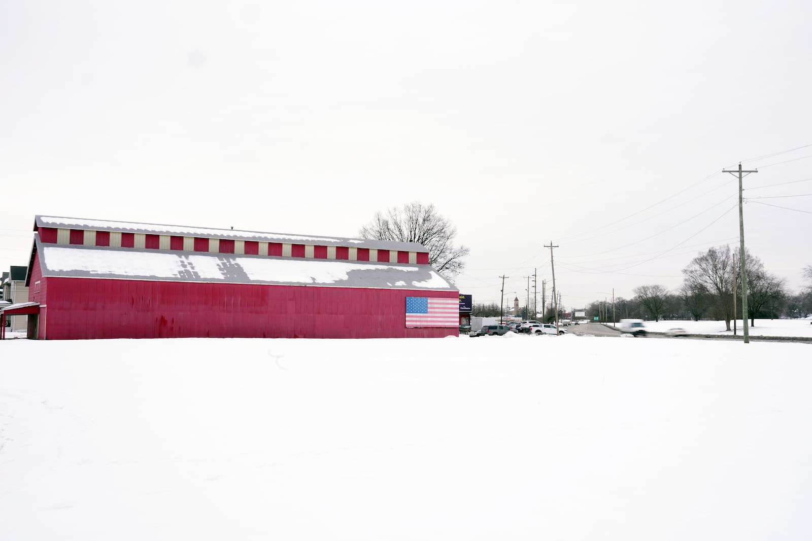 Vehicles travel along Verity Parkway after rounds of snow in recent weeks, pictured, Tuesday, Jan. 14, 2025, in Middletown, Ohio. The city is the hometown of Vice President-elect JD Vance.(AP Photo/Kareem Elgazzar)