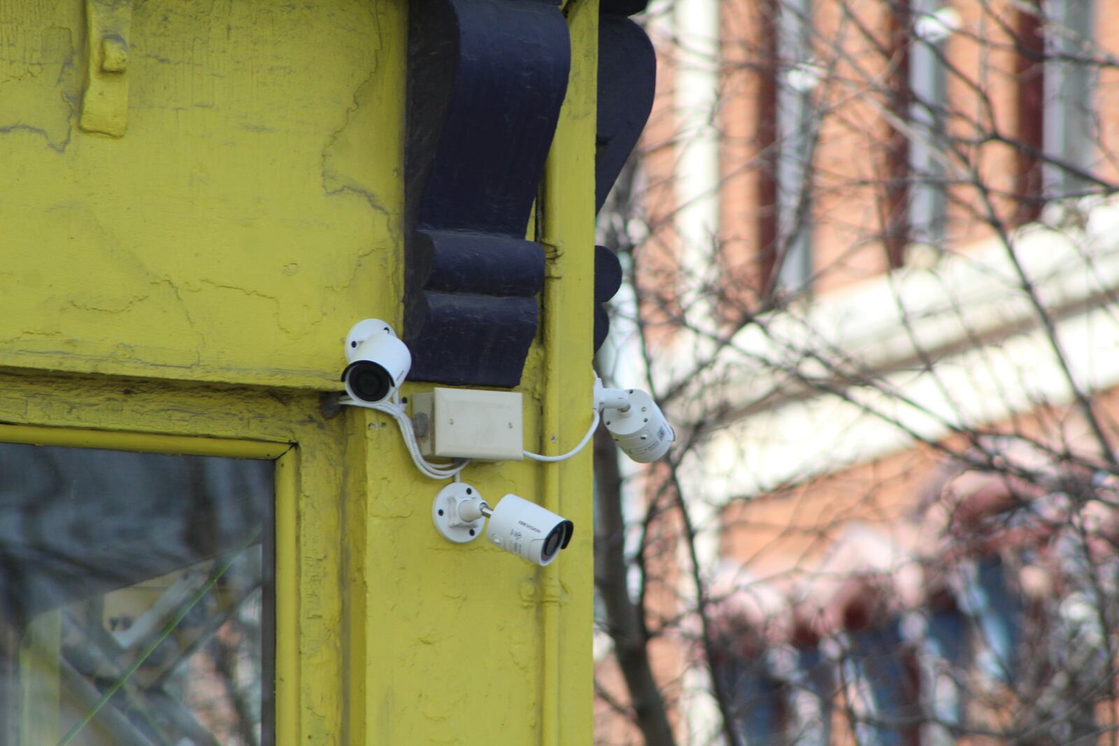 Security cameras outside of a business in the Oregon District in Dayton. CORNELIUS FROLIK / STAFF