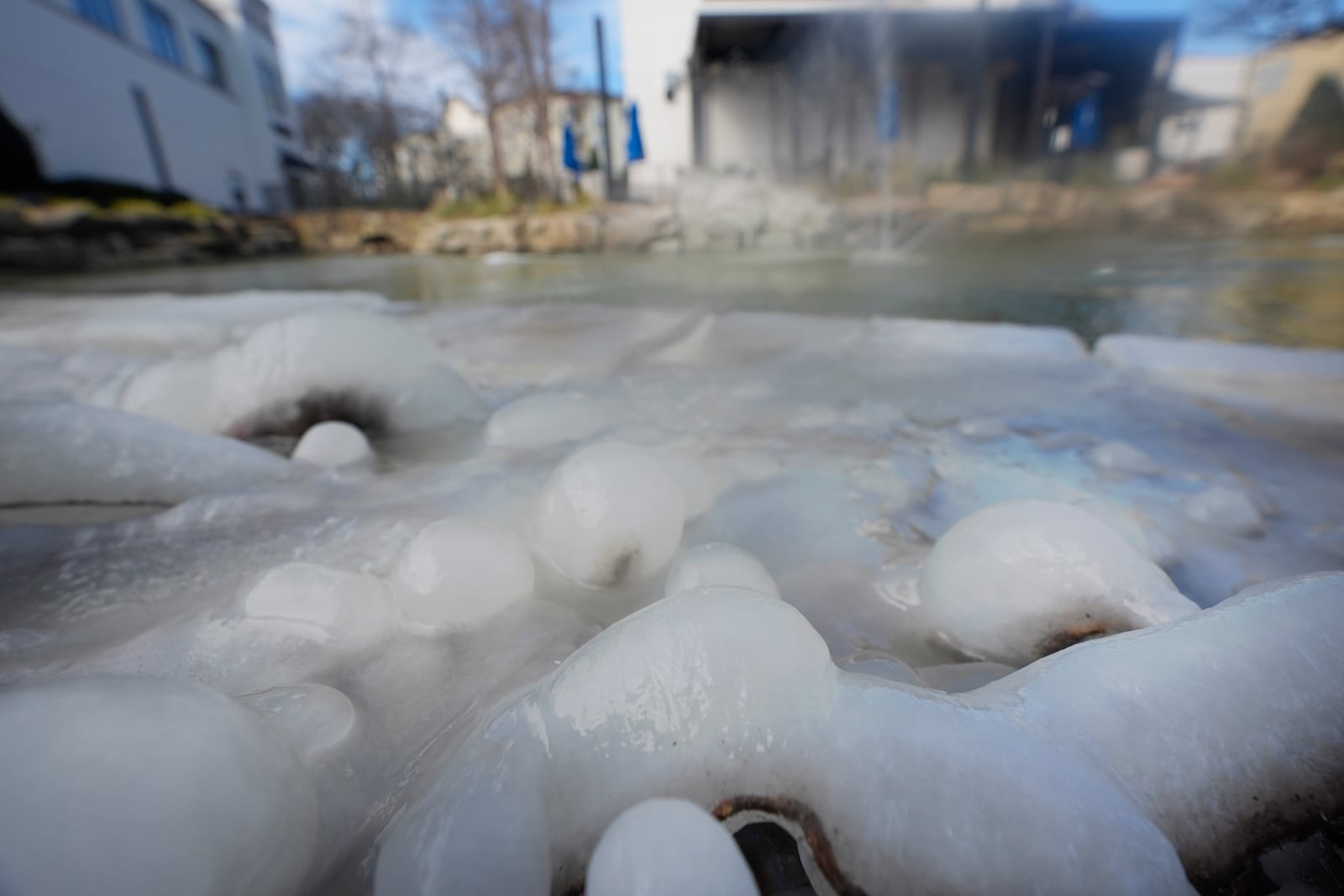 Cold temperatures freeze water in a fountain in Allen, Texas, Thursday, Feb. 20, 2025. (AP Photo/LM Otero)