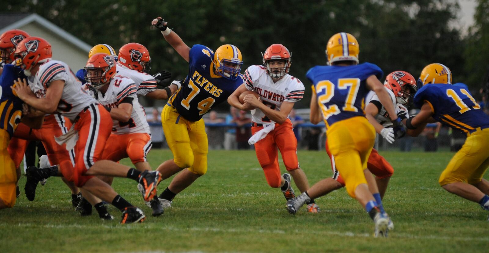 Marion Local junior defensive lineman John Dirksen (74) closes on Coldwater QB Dylan Thobe. Dirksen suffered what appeared to be a serious leg injury and was taken by EMS off the field. Coldwater defeated host Marion Local 17-14 in a Week 3 Midwest Athletic Conference high school football showdown at Maria Stein on Friday, Sept. 9, 2016. MARC PENDLETON / STAFF