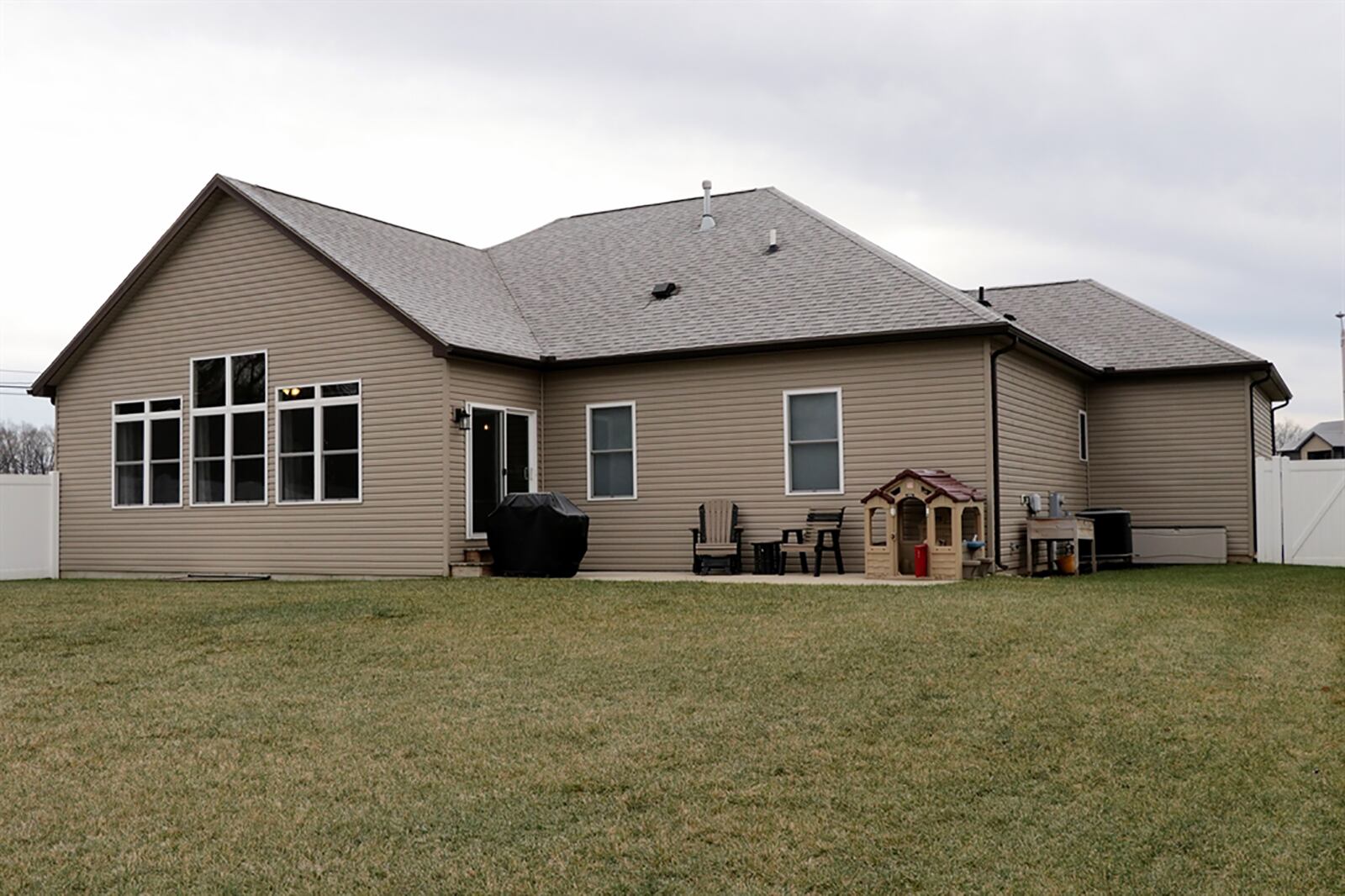 An 8-foot, white vinyl privacy fence was installed, surrounding the back yard and concrete patio. CONTRIBUTED PHOTO BY KATHY TYLER