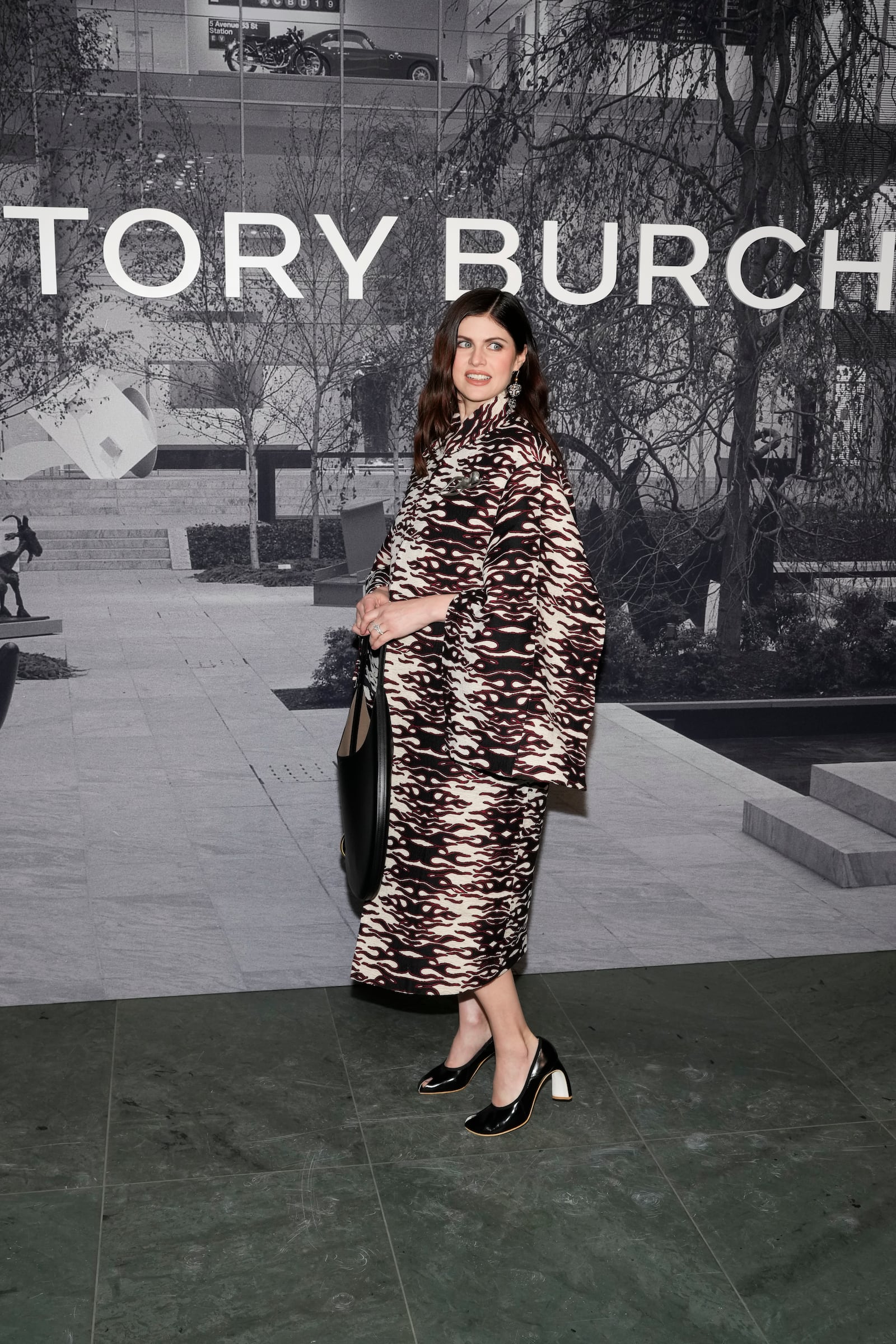 Alexandra Daddario arrives at the Tory Burch Fall/Winter 2025 fashion show as part of New York Fashion Week on Monday, Feb. 10, 2025, at the Museum of Modern Art in New York. (Photo by Charles Sykes/Invision/AP)