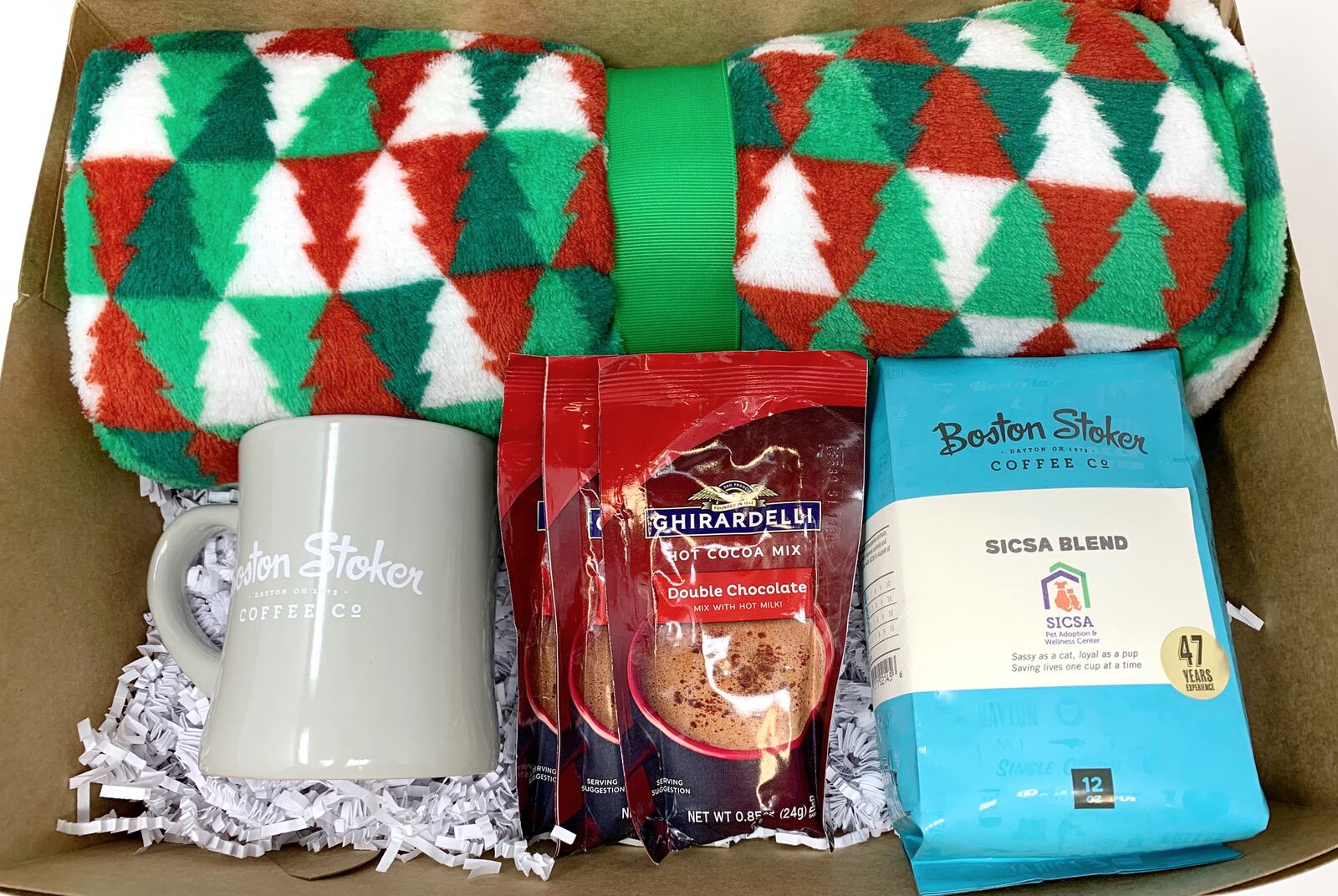 SICSA is offering holiday bundles making shopping easy. The "Comfy At Home" bundle features SICSA blend Boston Stoker coffee, a mugh, hot chocolate and a plush blanket for $25. CONTRIBUTED PHOTO