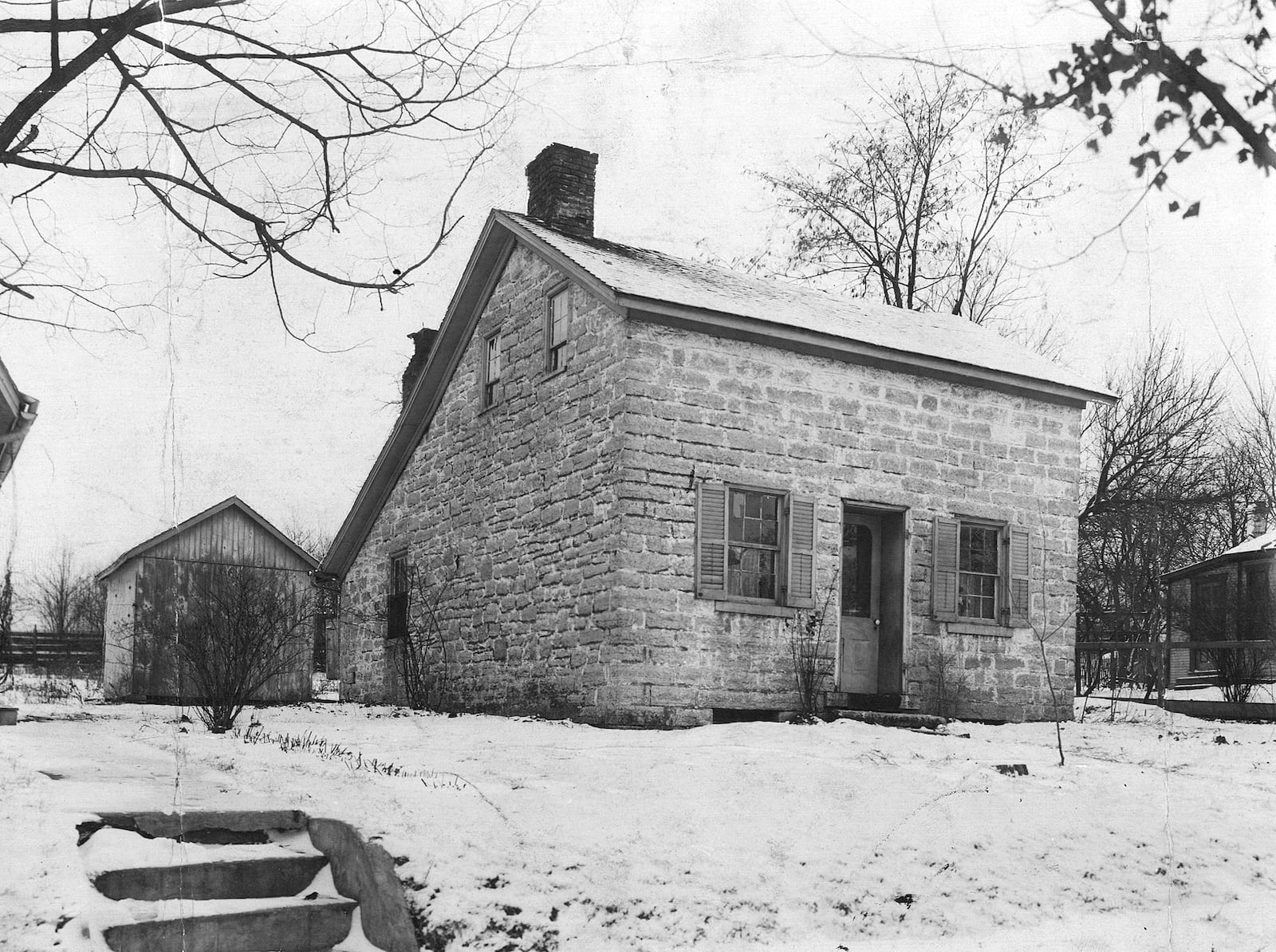 This stone house at 78 N. Main St. in Centerville is thought to have been built about 1810 by Aaron Nutt, one of the original surveyors and settlers in the area. The two-story building has stone walls 20” thick, a limestone cellar and a trap door. It also  features a central doorway with a pedimented hood and rectangular windows with stone lintels.
