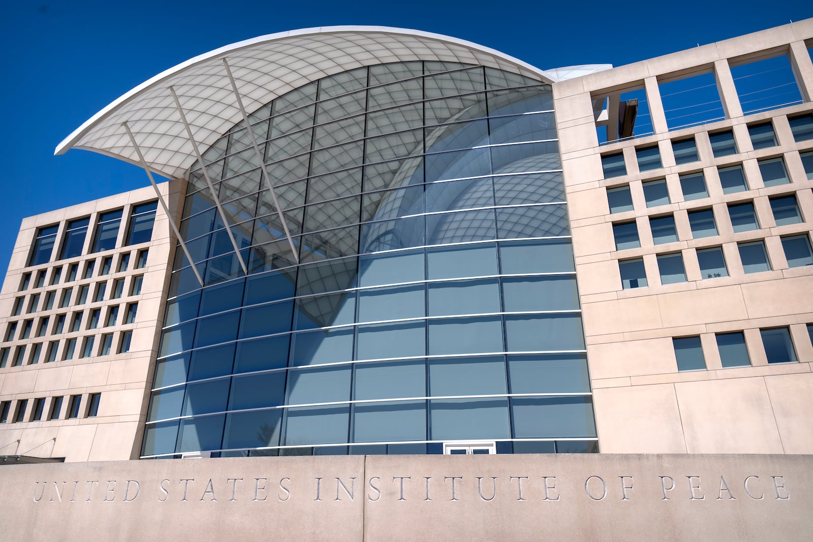 The headquarters of the United States Institute of Peace are seen Tuesday, March 18, 2025, in Washington. (AP Photo/Mark Schiefelbein).