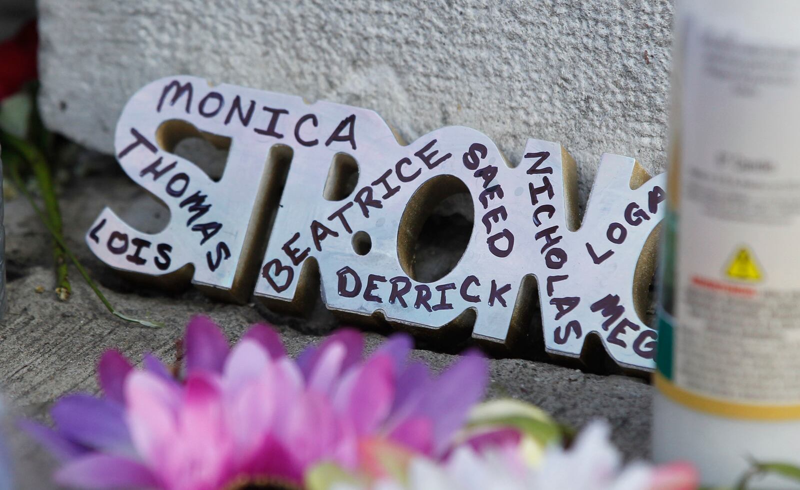 Memorials to the Dayton shooting victims and dozens of media workers filled the sidewalks of the Oregon District on Monday morning in the wake of ten people being killed, including the shooter, and more than two dozen injured at 1:00 A.M. on Sunday morning.  TY GREENLEES / STAFF