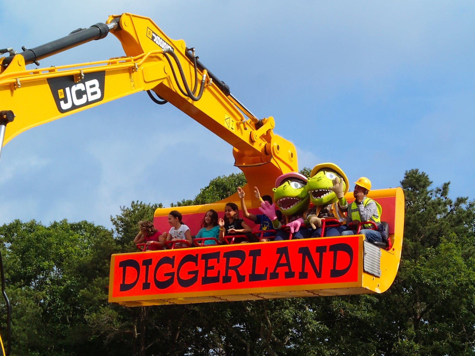 Guests ride in the modified bucket of a 20-ton JCB JS220 at Diggerland USA. PHOTO COURTESY DIGGERLAND USA