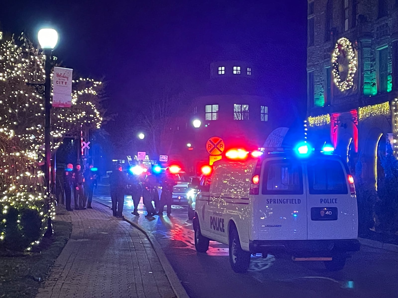 The area around Springfield’s downtown Esplanade was taped off as a crime scene after a man was reportedly shot in the parking lot of the Clark County Heritage Center Friday night following the Holiday in the City celebration. BILL LACKEY/STAFF