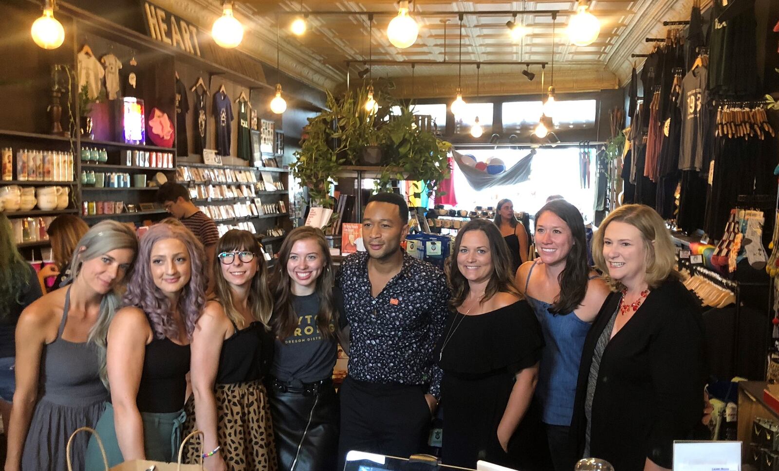 John Legend made a surprise visit to the Oregon District Sunday evening with Dayton Mayor Nan Whaley to show support in the aftermath of the mass shooting Sunday, Aug. 4. He stopped by a number of stores to shop including Heart Mercantile, Brim on Fifth, Puff Apothecary and Beck + Call.  AMELIA ROBINSON / STAFF