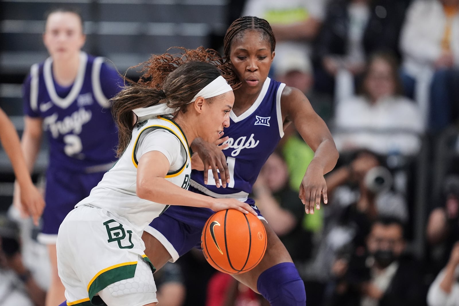 Baylor's Jada Walker, left, works to get around TCU guard Agnes Emma-Nnopu, right, in the second half of an NCAA college basketball game in Waco, Texas, Sunday, March 2, 2025. (AP Photo/Tony Gutierrez)