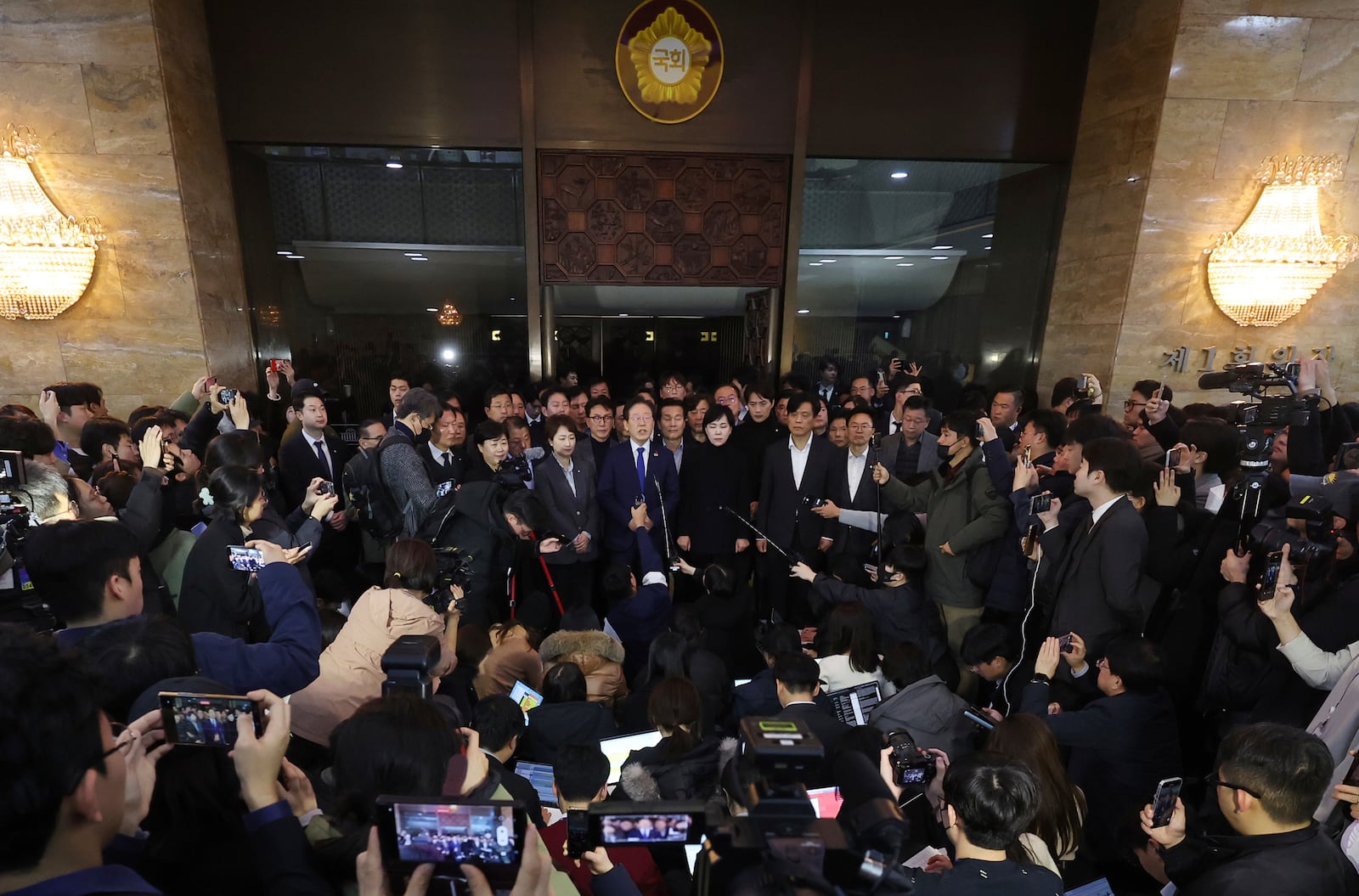 South Korea's main opposition Democratic Party leader Lee Jae-myung, top center, speaks at the National Assembly in Seoul, South Korea, Wednesday, Dec. 4, 2024. (Kim Ju-hyung/Yonhap via AP)