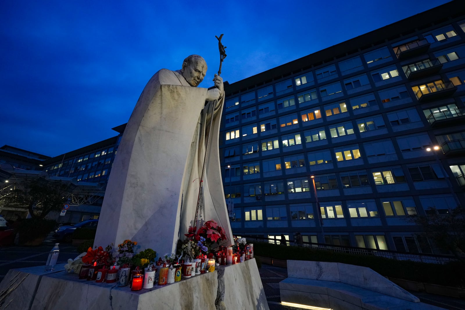 A statue of Pope John Paul II is seen in front of the Agostino Gemelli Polyclinic, Rome, Wednesday, Feb. 19, 2025, where the Pontiff is hospitalized since Friday, Feb. 14. (AP Photo/Andrew Medichini)