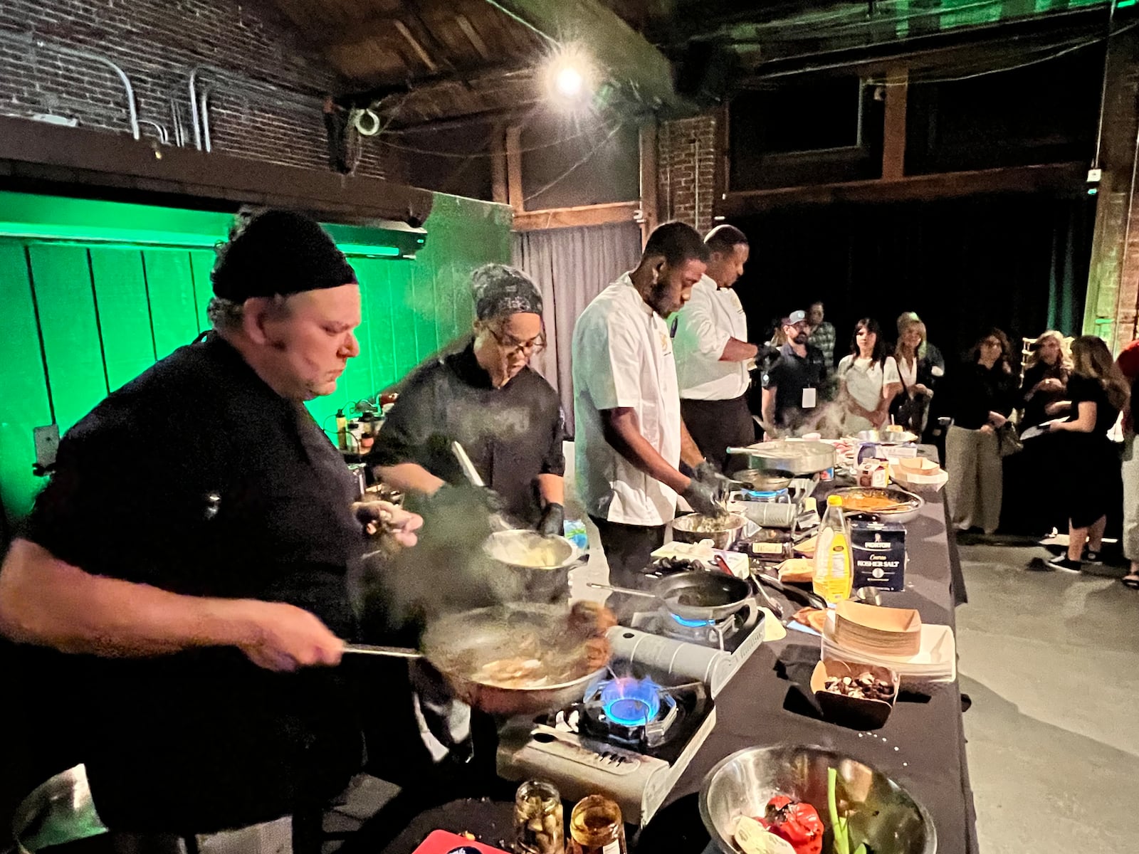 The final round of the Diced in Dayton Chef's Challenge saw the team from Corner Kitchen led by executive chef Gavin St. Denis (far left), face off agains the team from Rich Taste Catering led by chef and owner Gerald Richardson (far right).