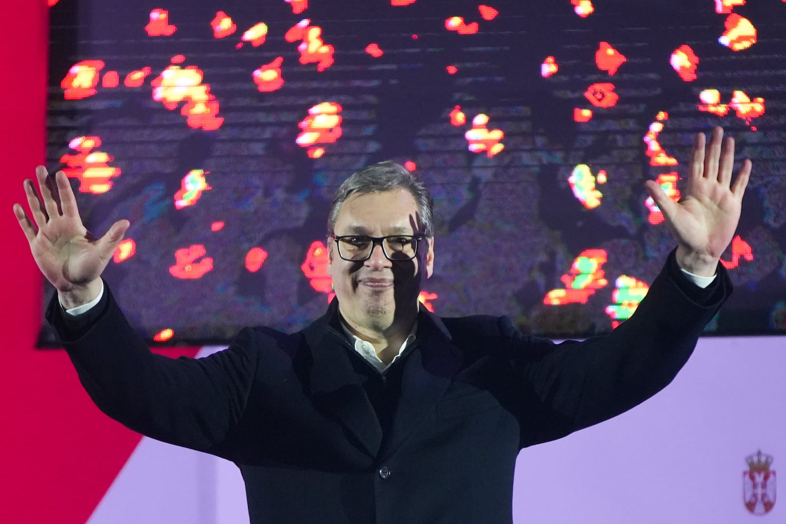 Serbian President Aleksandar Vucic waves to his supporters during a rally marking the country's Statehood Day in Sremska Mitrovica, Serbia, Saturday, Feb. 15, 2025. (AP Photo/Antonio Ahel)