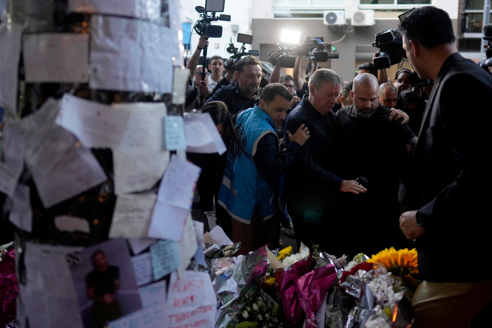 Geoff Payne, center, the father of former One Direction singer Liam Payne, is escorted by police officers as he arrives to the Casa Sur Hotel where his son fell to his death from a hotel balcony, in Buenos Aires, Argentina, Friday, Oct. 18, 2024. (AP Photo/Natacha Pisarenko)