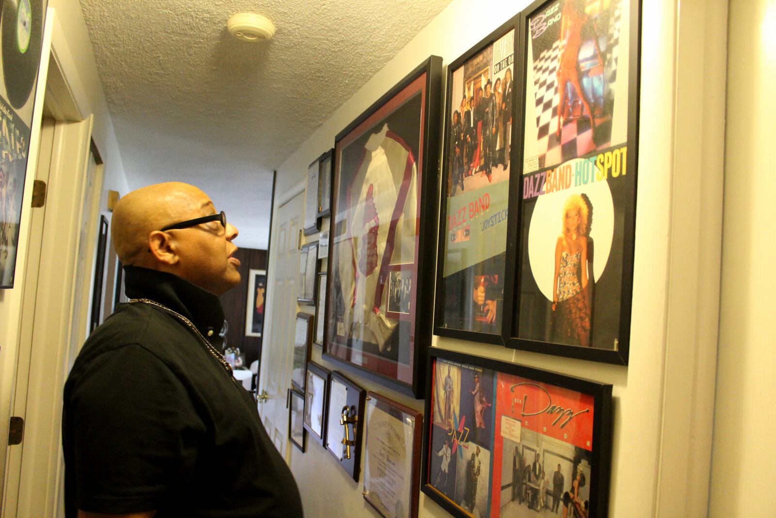 Memorabilia and awards, including those related to his Grammy, fill the hallway leading to  Keith Harrison's home studio. Harrison was a member or Faze-O, Heatwave and the Dazz Band.