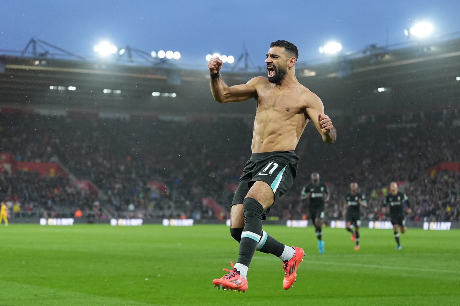 Liverpool's Mohamed Salah celebrates after scoring during the English Premier League soccer match between Southampton and Liverpool in Southampton, England, Sunday, Nov. 24, 2024. (AP Photo/Sean Ryan)