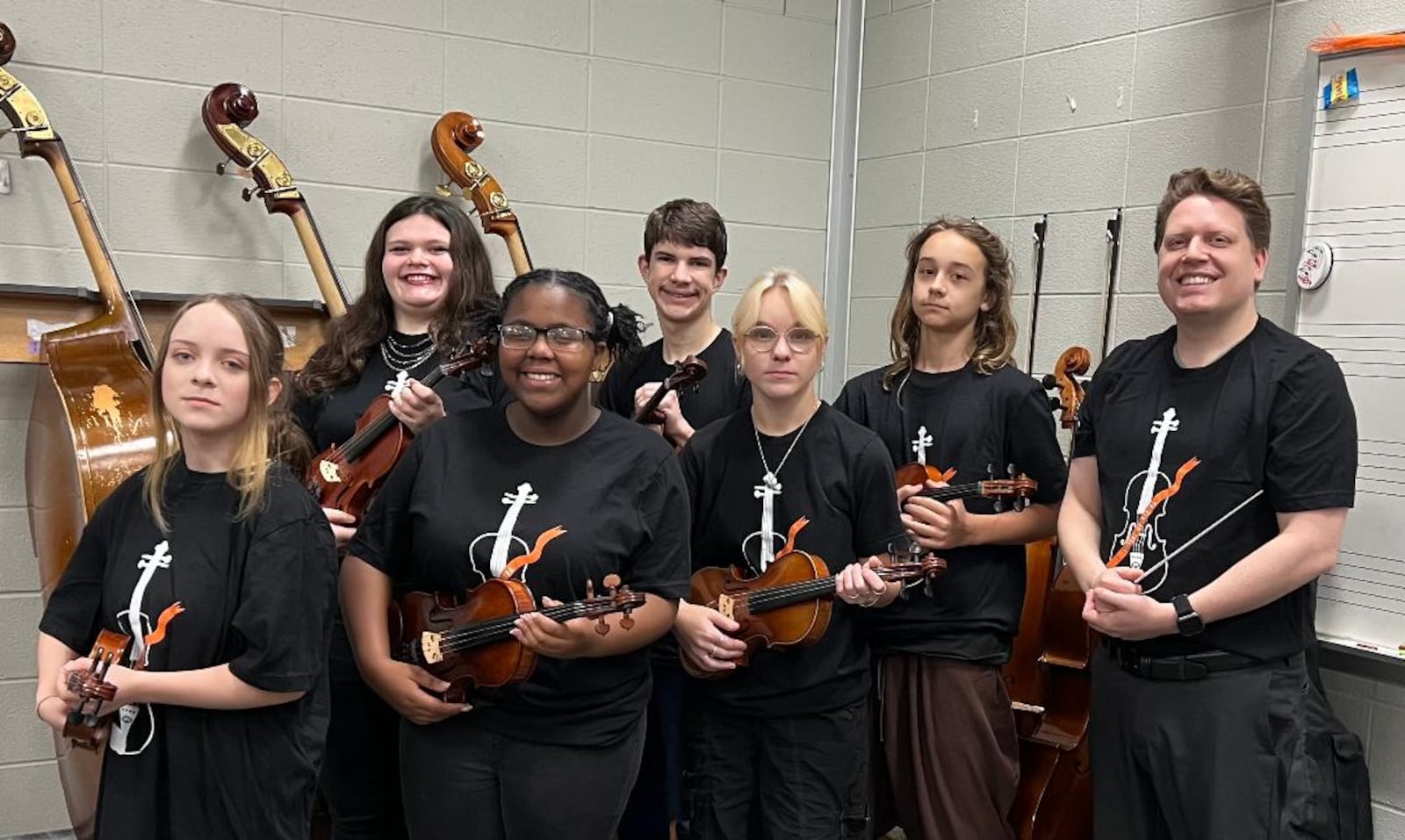 Students from Stivers School for the Arts will join The Piano Guys Nov. 15 at the Schuster Center. Back row left to right: Adelyn Springhart, Lian Holtgrave, and Agustin Bell. Front Row left to right: Jay Begley, Jamarie Jones, Emma Hall, and Stivers Orchestra Director James Hogan. CONTRIBUTED