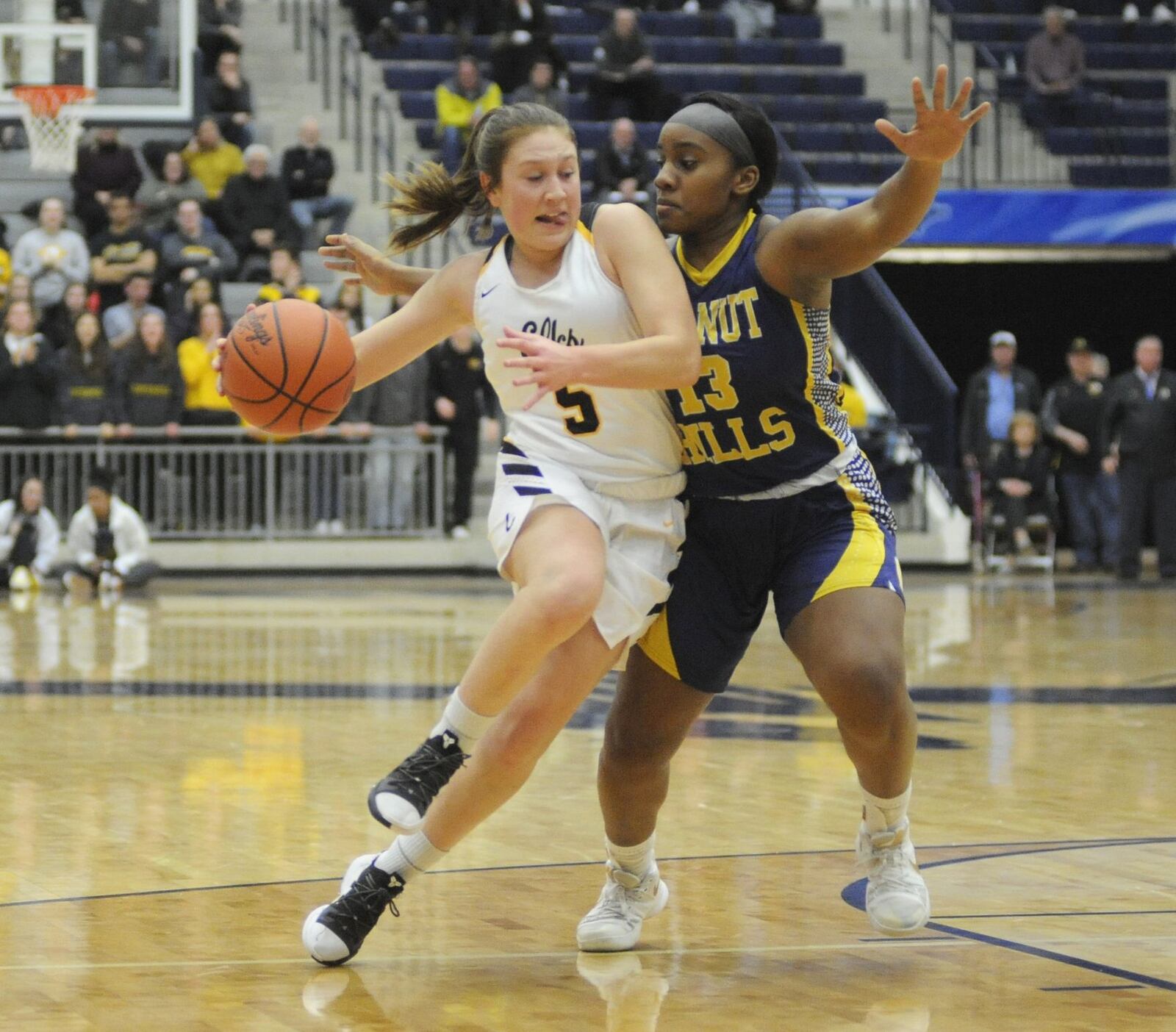 Kenzie Smith of Centerville (with ball) drives on Alysea Jenkins of Walnut Hills. Centerville defeated Cin. Walnut Hills 54-39 in a girls high school basketball D-I regional final at Fairmont’s Trent Arena on Wednesday, March 6, 2019. MARC PENDLETON / STAFF