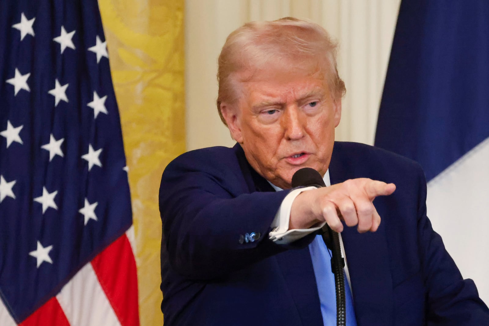 President Donald Trump speaks during a joint press conference with France's President Emmanuel Macron in the East Room of the White House in Washington, Monday, Feb. 24, 2025. (Ludovic Marin/Pool via AP)