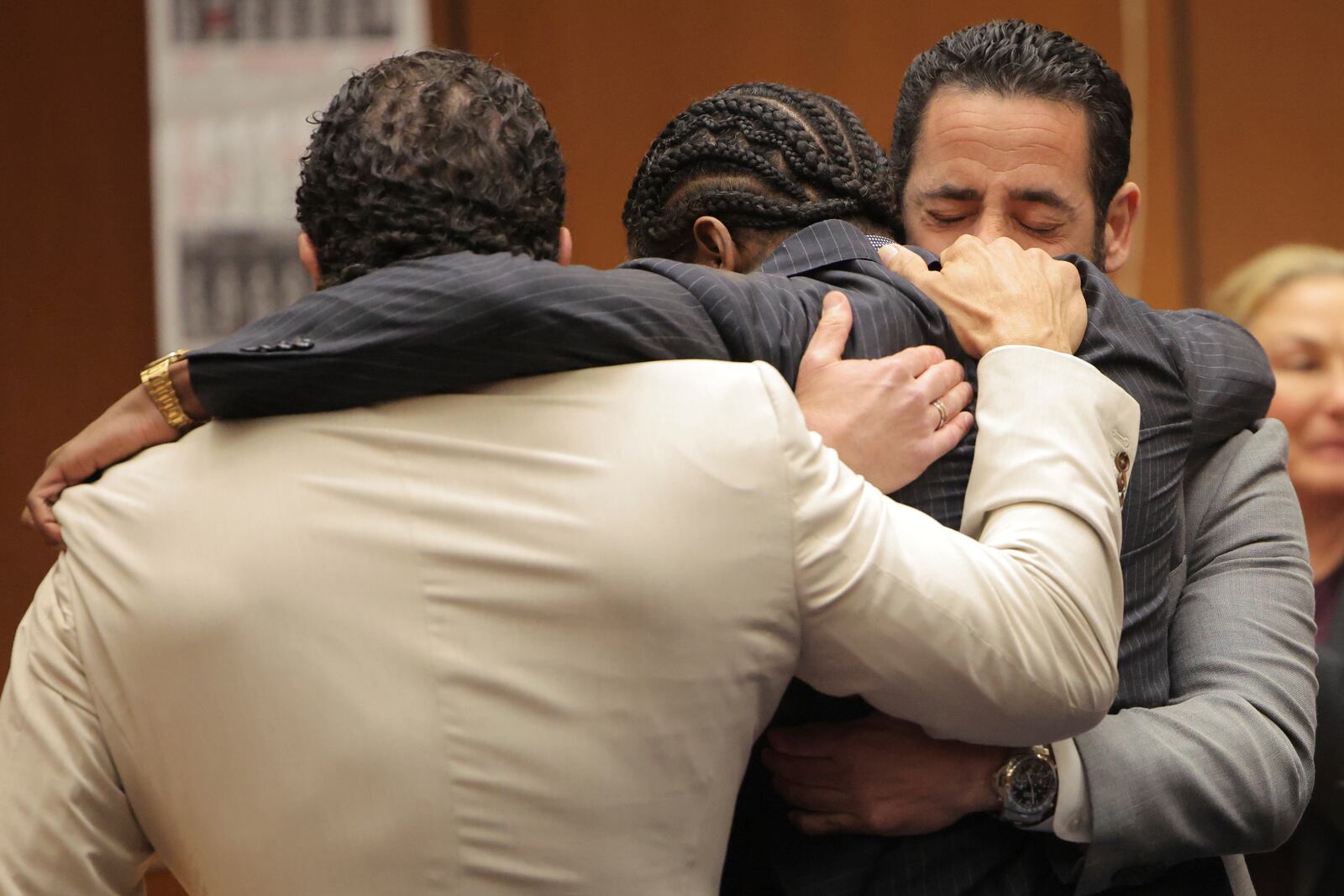 A$AP Rocky, center, is hugged in the courtroom after he was found not guilty during his trial Tuesday, Feb. 18, 2025, in Los Angeles. (Daniel Cole/Pool Photo via AP)