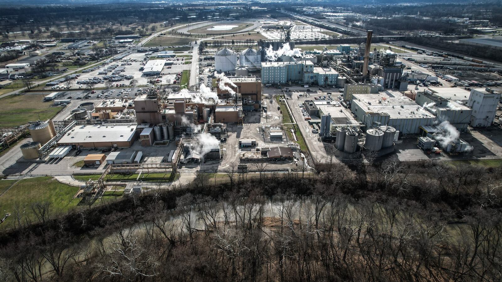 In late 2023, corn gluten meal spilled from the Cargill plant in North Dayton into a channel of the Great Miami River (seen at bottom of photo). JIM NOELKER/STAFF