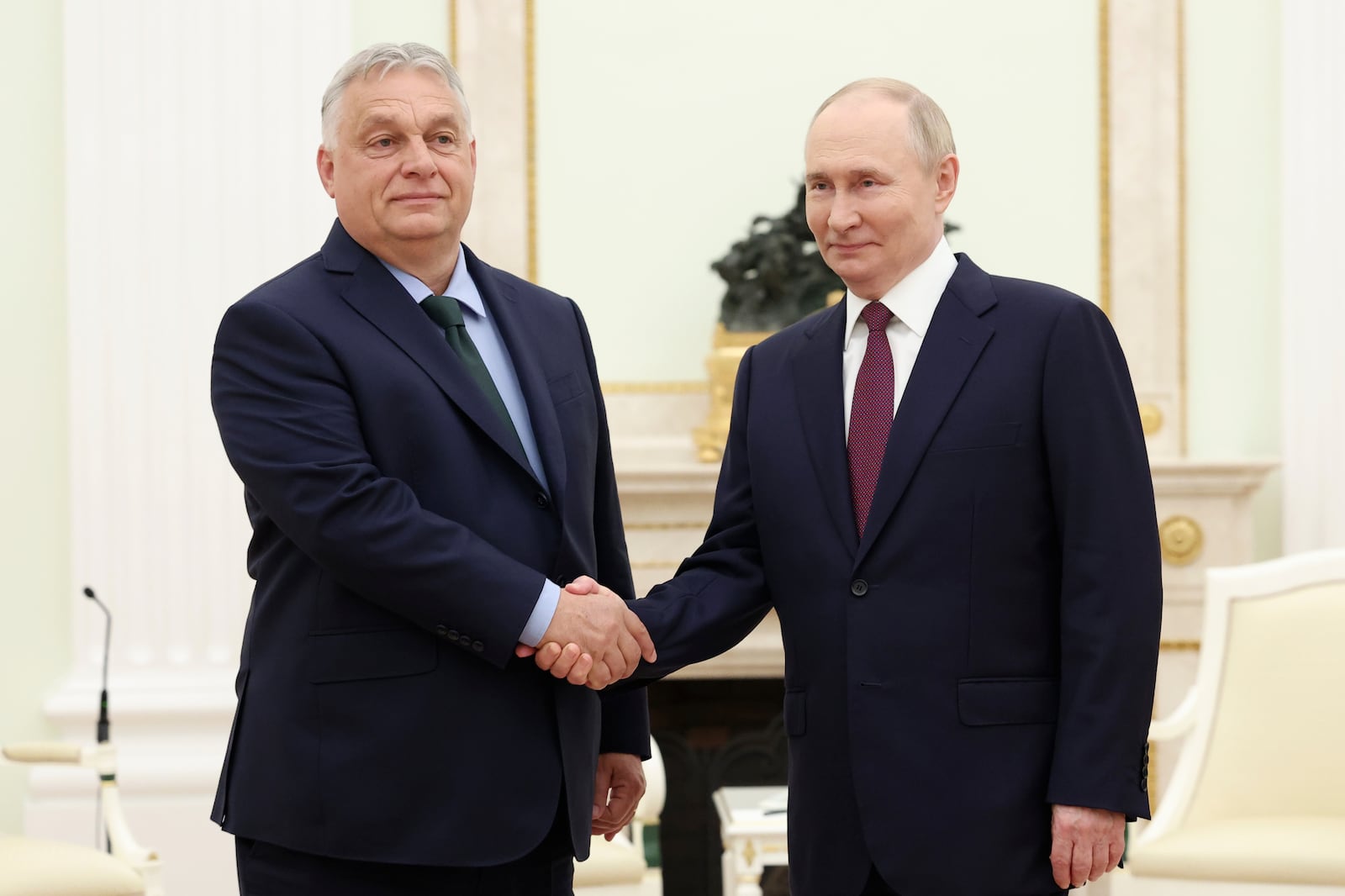 FILE - Russian President Vladimir Putin, right, and Hungarian Prime Minister Viktor Orban shake hands during a meeting in Moscow, July 5, 2024. (Valeriy Sharifulin, Sputnik, Kremlin Pool Photo via AP)