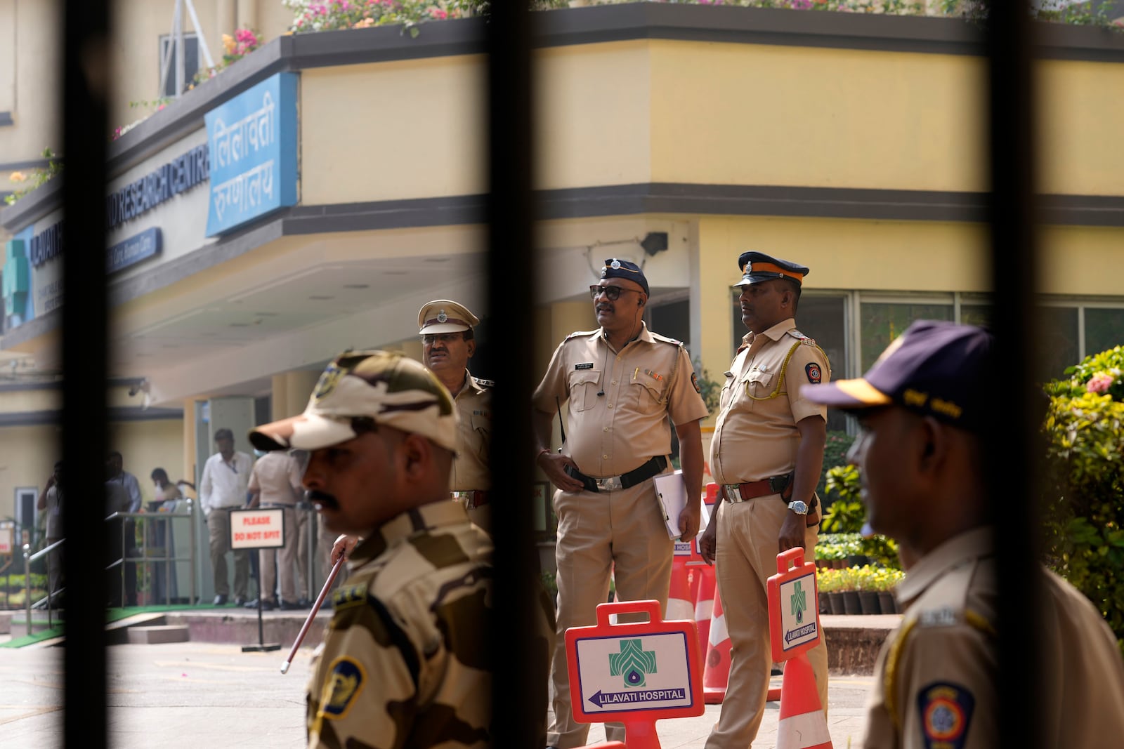 Police personnel stand outside Lilavati hospital where Bollywood actor Saif Ali Khan underwent surgery for stab injuries after a scuffle with an intruder at his home in Mumbai, Thursday, Jan. 16, 2025.(AP Photo/Rajanish Kakade)