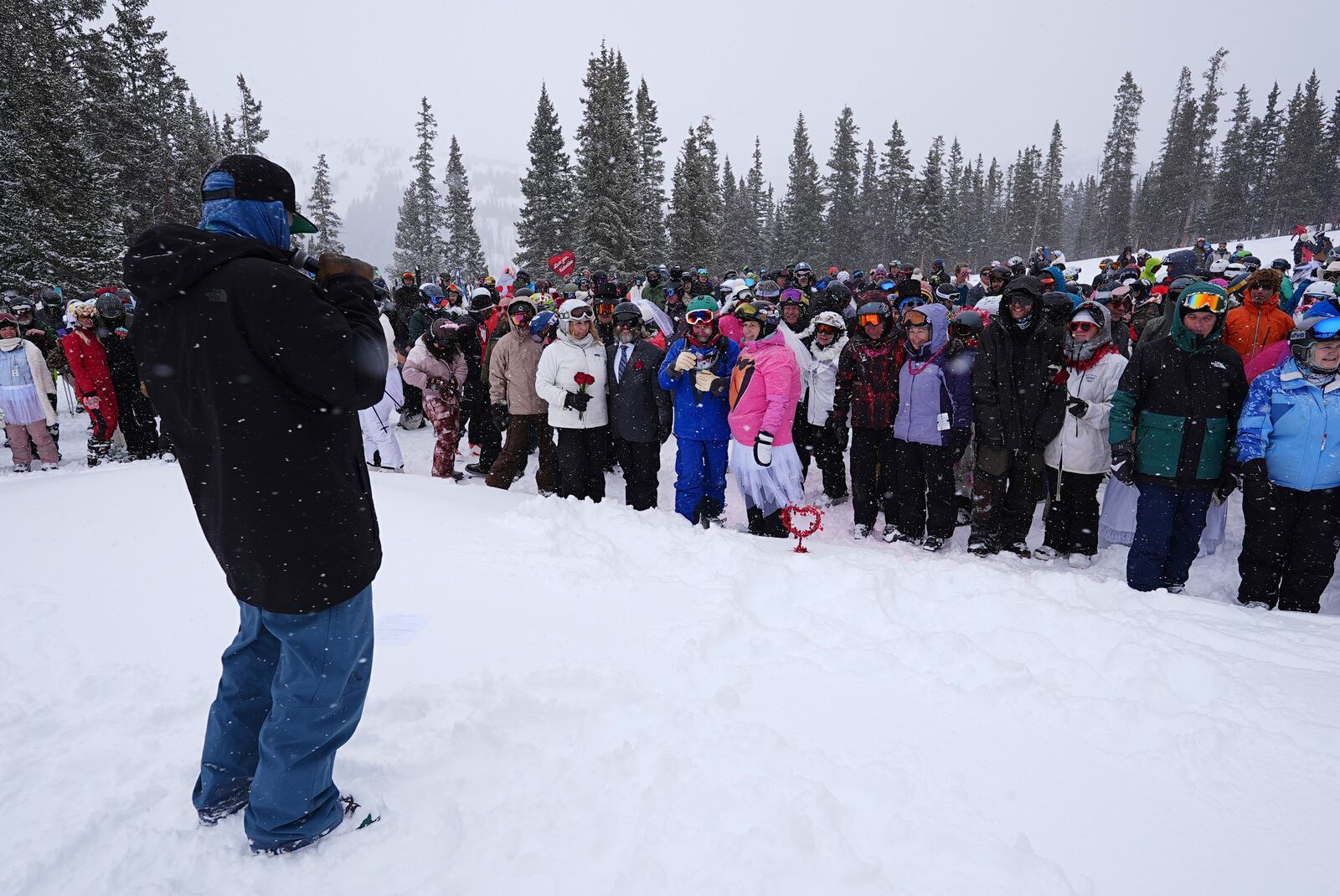 Couples gather during the 35th annual Marry Me & Ski for Free Valentine's Day mountaintop matrimony ceremony Friday, Feb. 14, 2025, at Loveland Ski Area, Colo. (AP Photo/David Zalubowski)