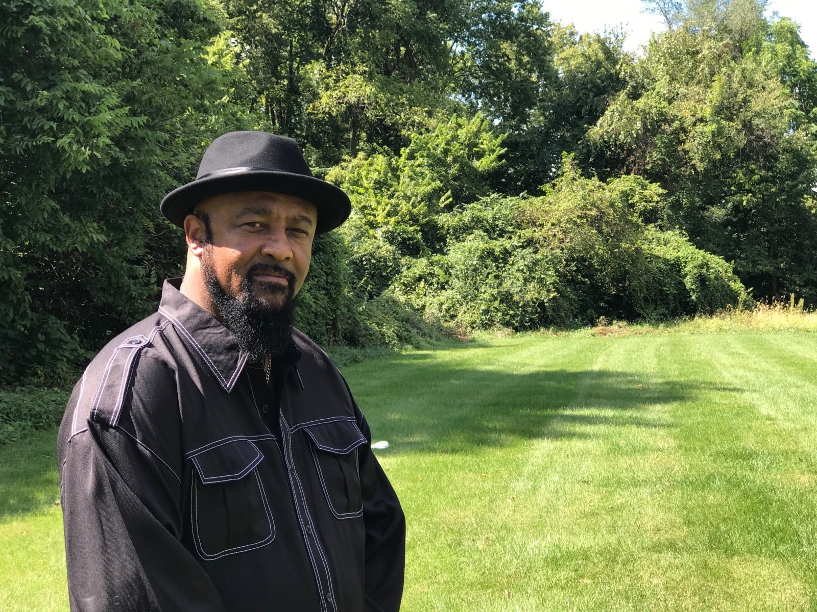 Cliff Pierce at the now overgrown field that once served as the ball park in their Lower Dayton View neighborhood. He referred to it as “Our Field of Dreams.” Pierce – who grew up in Lexington Avenue, was the captain of the Fairview High basketball team in the mid-1970s and now is a local historian and the pit master of “Take a Bite Out of Fine” Bulldog Bar-B Que - put together a recent reunion of the neighborhood kids. The Rev. Dr. Winston Lindsey, who also grew up in the neighborhood, starred in track at Fairview and in college and now is a minister in New Jersey, calls Pierce “The Great Connector.” Tom Archdeacon/STAFF