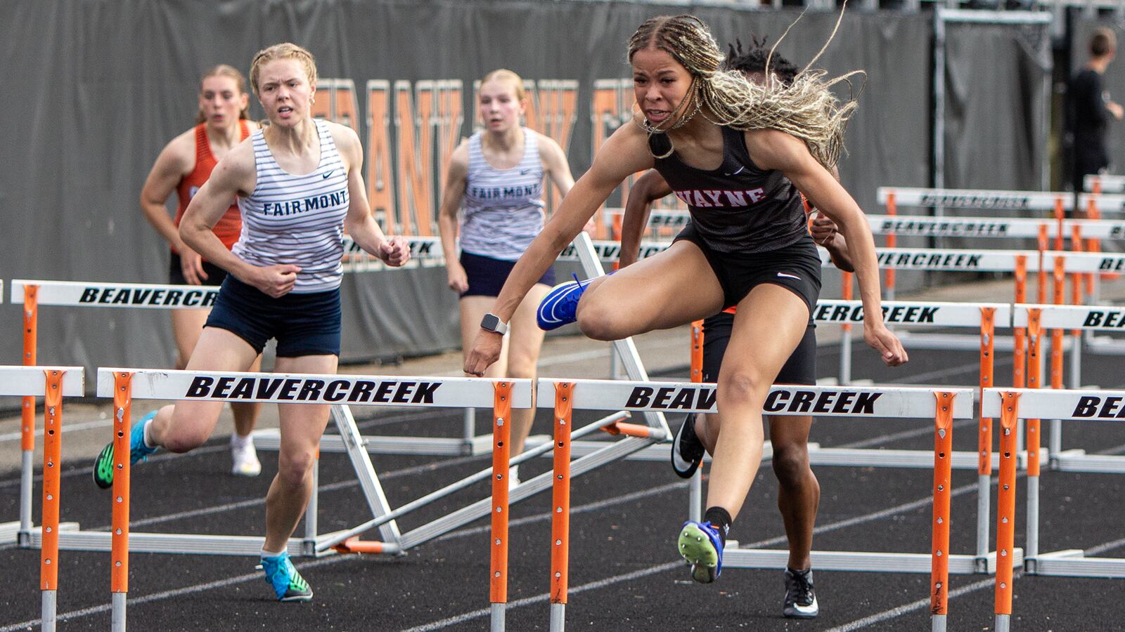 Wayne's Ric'Keya White wins the 100-meter hurdles in a meet-record 14.28 seconds at the GWOC meet Wednesday at Beavercreek High School. She also set a meet record in winning the 300 hurdles. Jeff Gilbert/CONTRIBUTED