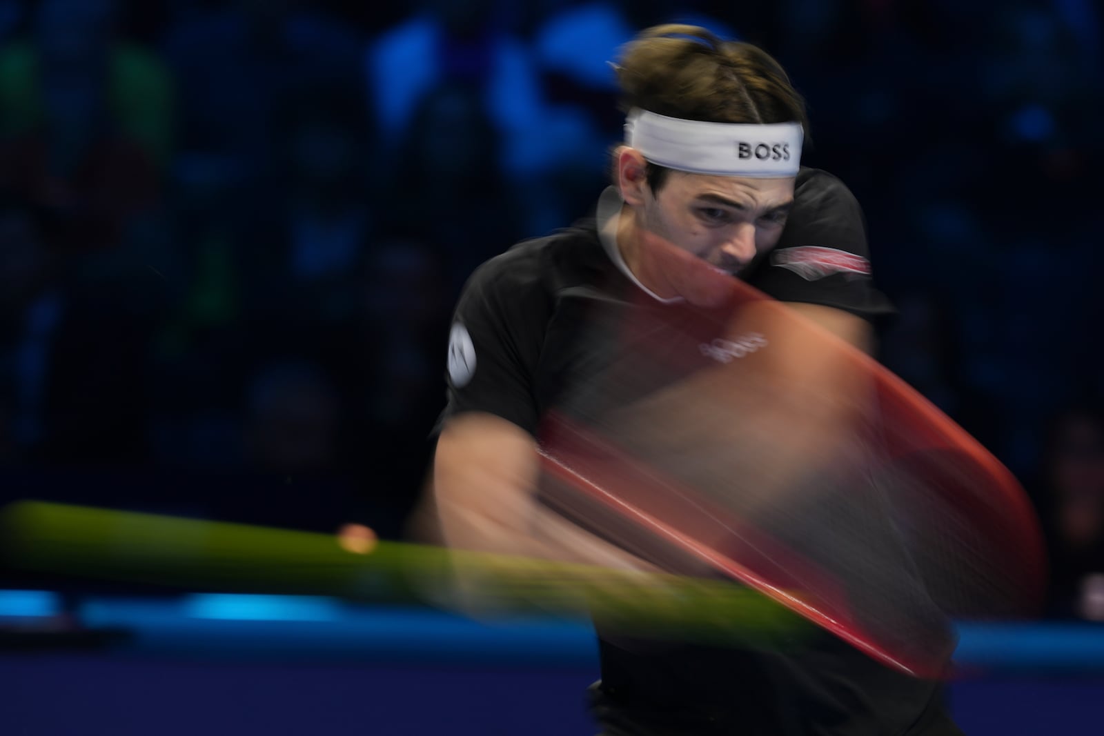 Taylor Fritz of the United States returns to Italy's Jannik Sinner during the final match of the ATP World Tour Finals at the Inalpi Arena, in Turin, Italy, Sunday, Nov. 17, 2024. (AP Photo/Antonio Calanni)