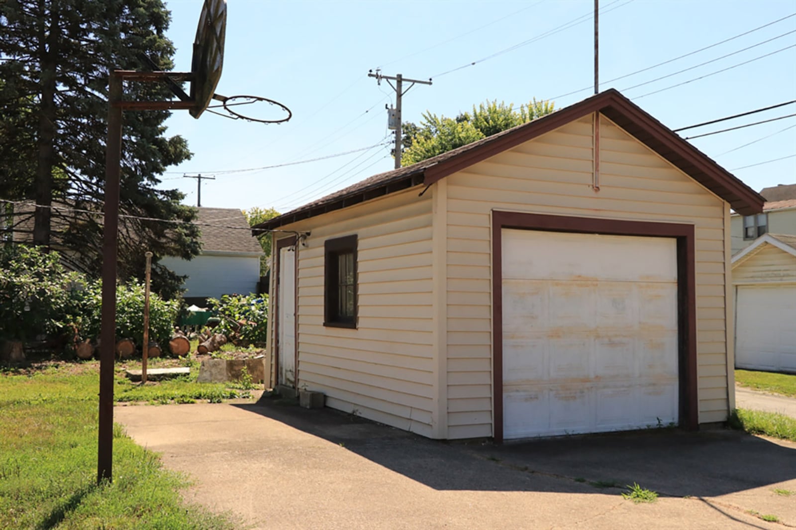 The 1-car garage has front entry off the side street and has a side service door. There is extra off-street parking, and the property has alley access. CONTRIBUTED PHOTO BY KATHY TYLER