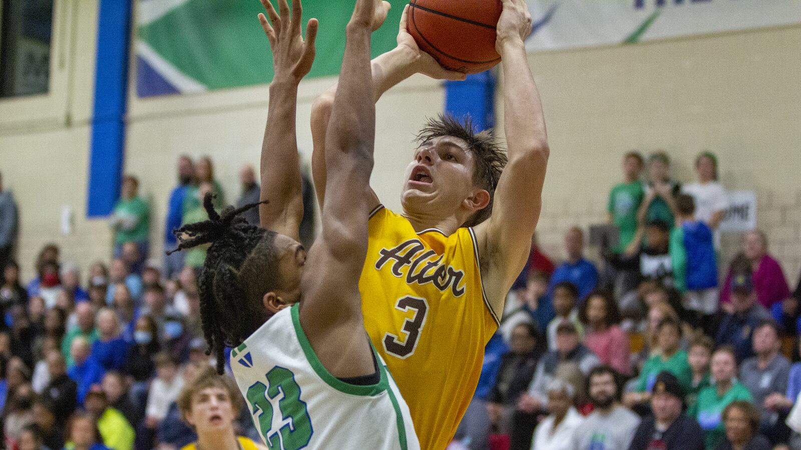 Alter's Anthony Ruffolo shoots over Chaminade Julienne's David Cartwright during Friday night's game at CJ. Ruffolo scored 33 points in the Knights' 77-70 loss. CONTRIBUTED/Jeff Gilbert