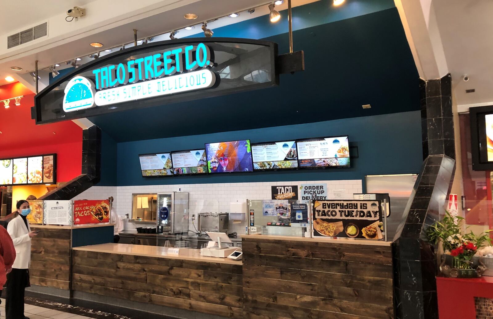 Taco Street Co. in the food court of the Mall at Fairfield Commons in Beavercreek offers menu items such as jerk chicken tacos, shrimp taco with mango salsa, taco salads, Mexican street corn, and more. MARK FISHER/STAFF