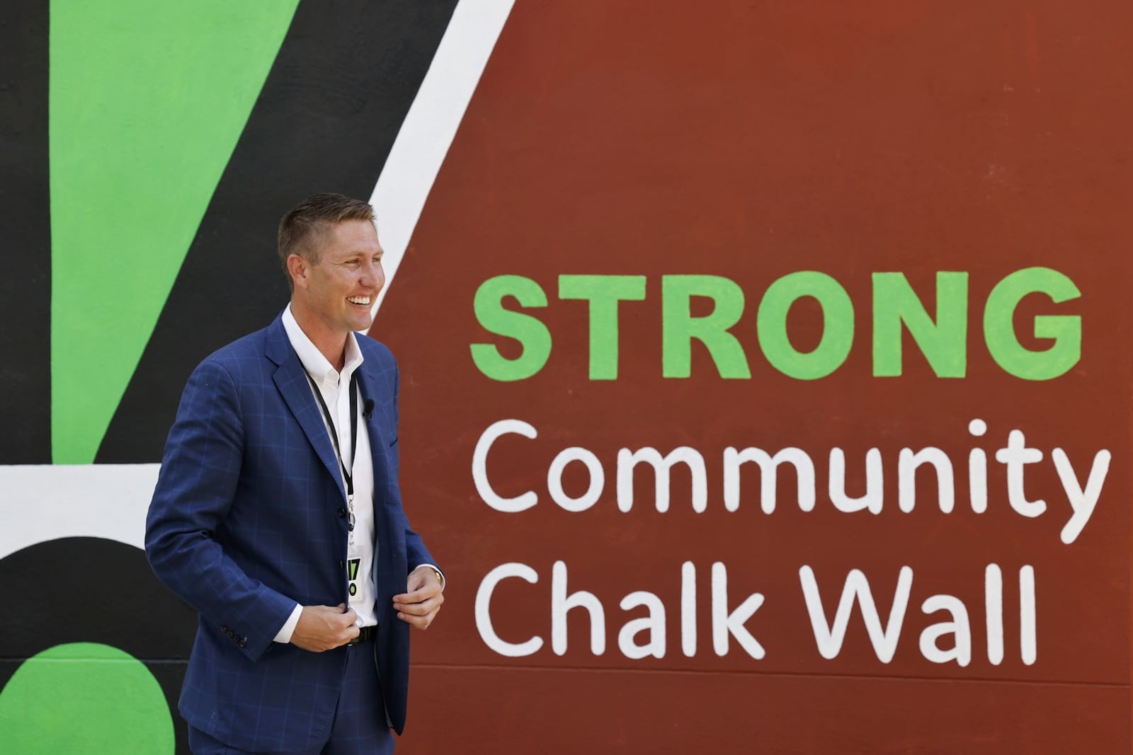 David Stark gets interviewed by a television station during Chalk It Up Hamilton, a community art event, Tuesday, July 19, 2022 at Rotary Park in Hamilton. NICK GRAHAM/STAFF