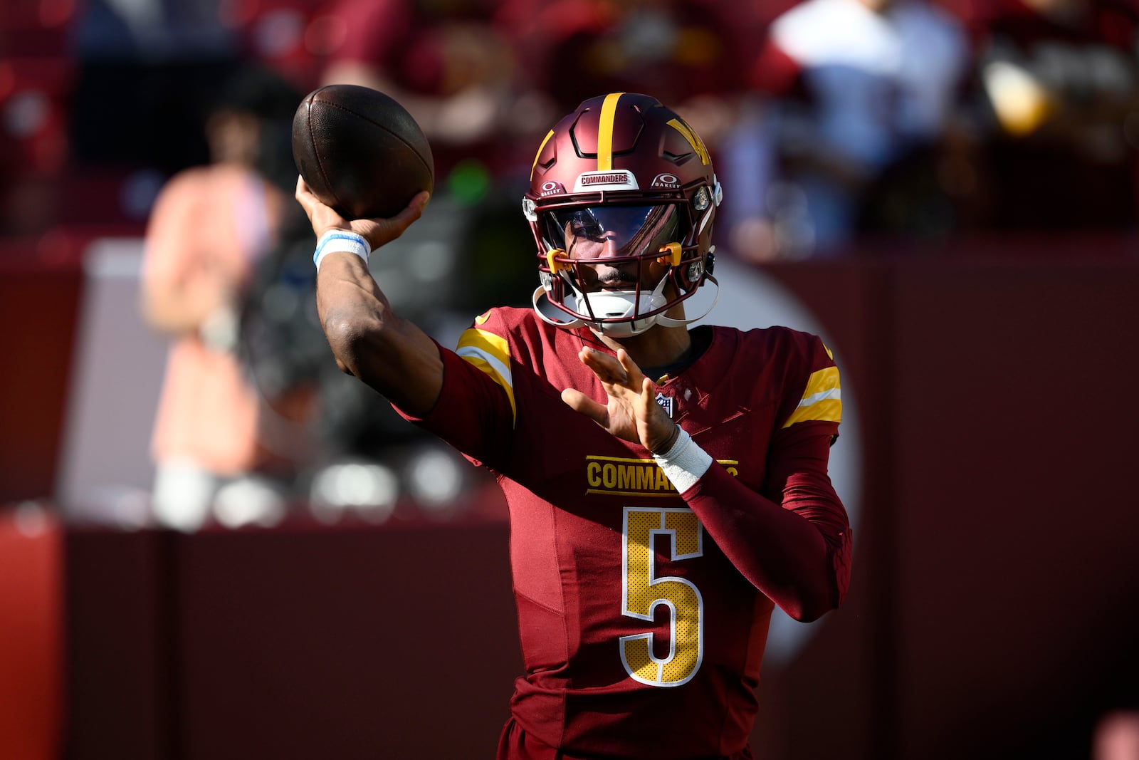 Washington Commanders quarterback Jayden Daniels warms up before an NFL football game against the Carolina Panthers, Sunday, Oct. 20, 2024, in Landover, Md. (AP Photo/Nick Wass)